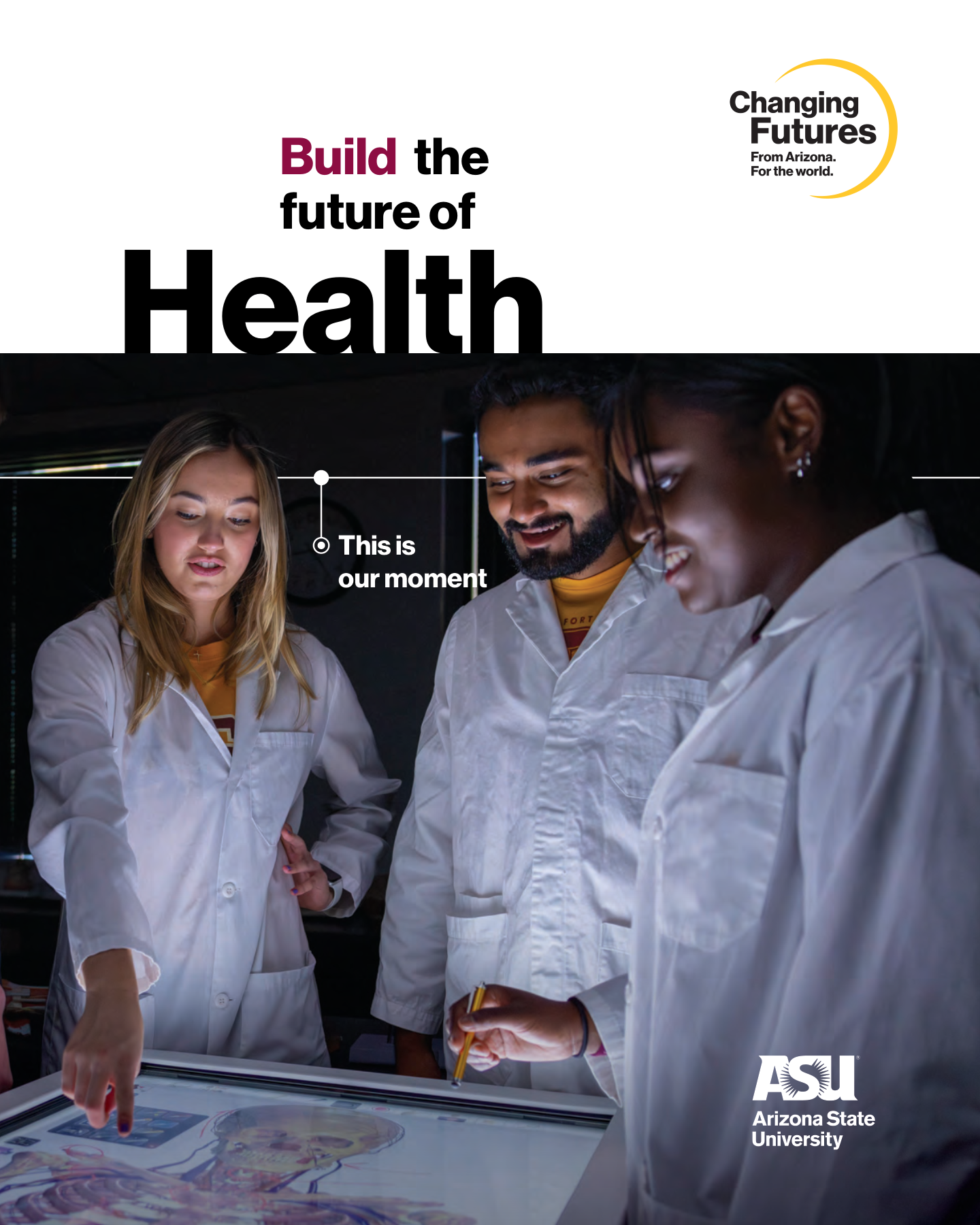 Three students, two women and one man, wearing white lab coats, gathered around a touch screen table, looking at digital content. They are smiling and discussing. There is text overlay stating "This is our moment." The Arizona State University logo i