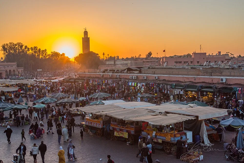 Sun about to set over Fna square, Marrakech, Morocco