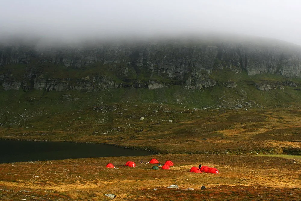 "Camping under the clouds". A group of tents by a small lake in Härjedalen, Sweden