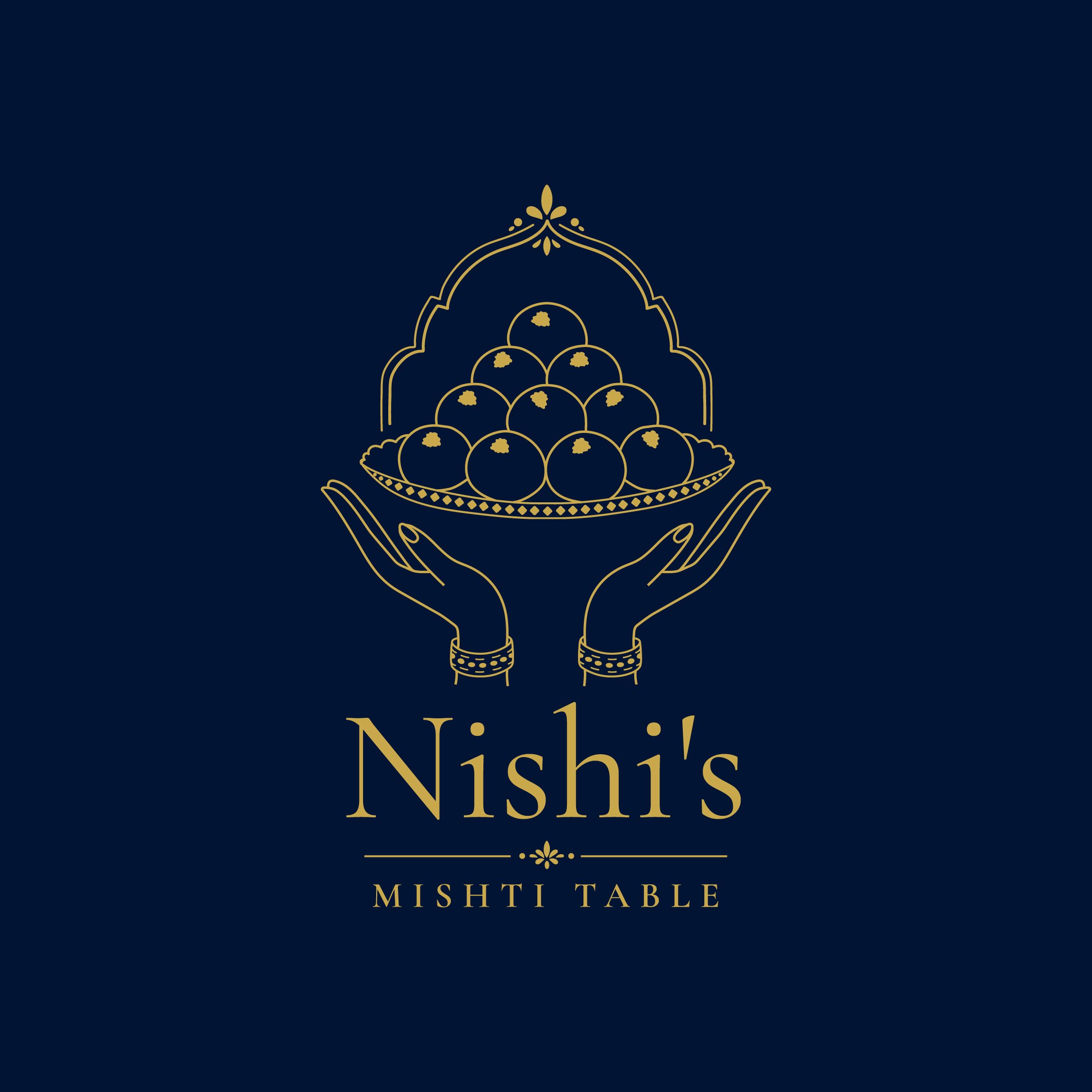 Cover with navy background and gold decorative illustration of a MishTi Table logo, which includes a stylized design, likely representing a serving tray with mini bowls or fondue pots on it, and the text 'Nishi MishTi Table' in gold.