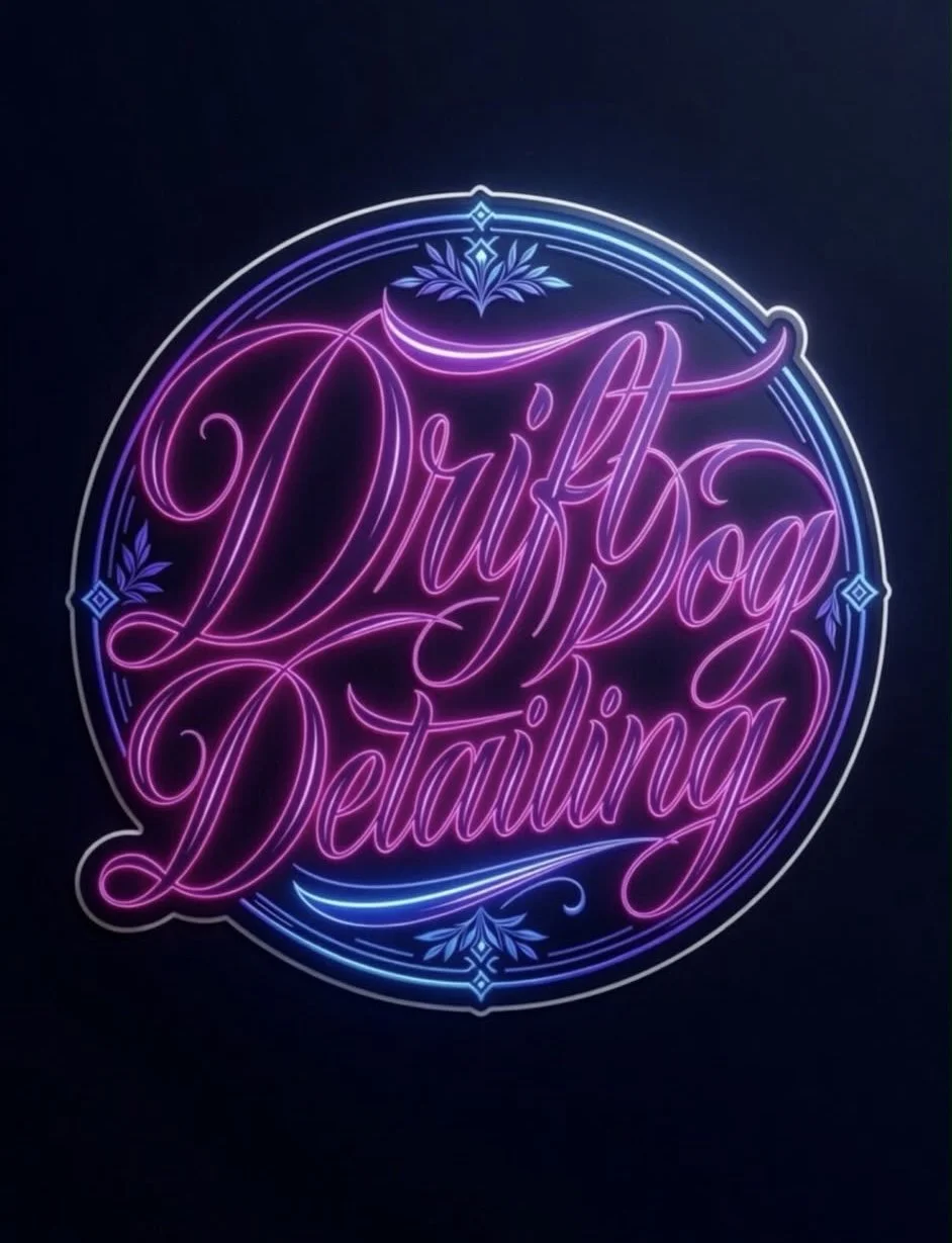 Neon sign with the words 'Drift Dog Detailing' in pink and purple script, surrounded by decorative blue accents on a dark background.