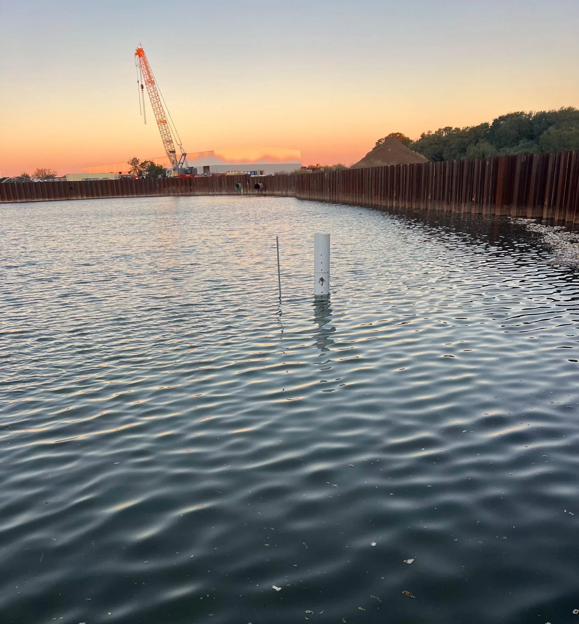 Hippos Construction team constructing a modern retention pond and stormwater management system to ensure proper drainage in Hutto, Texas