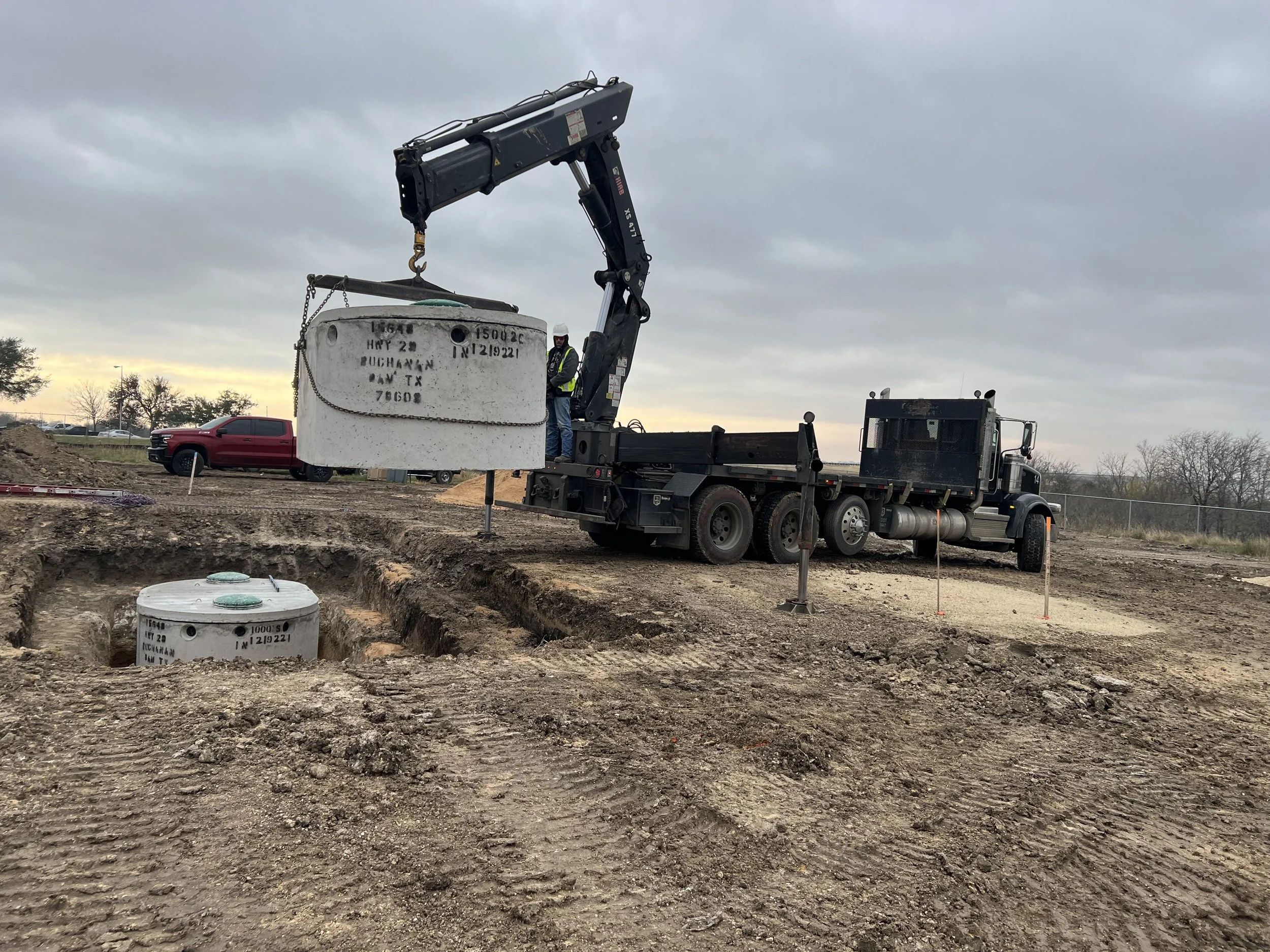Hippos Construction mini excavator installing a commercial septic system in Hutto, Texas.