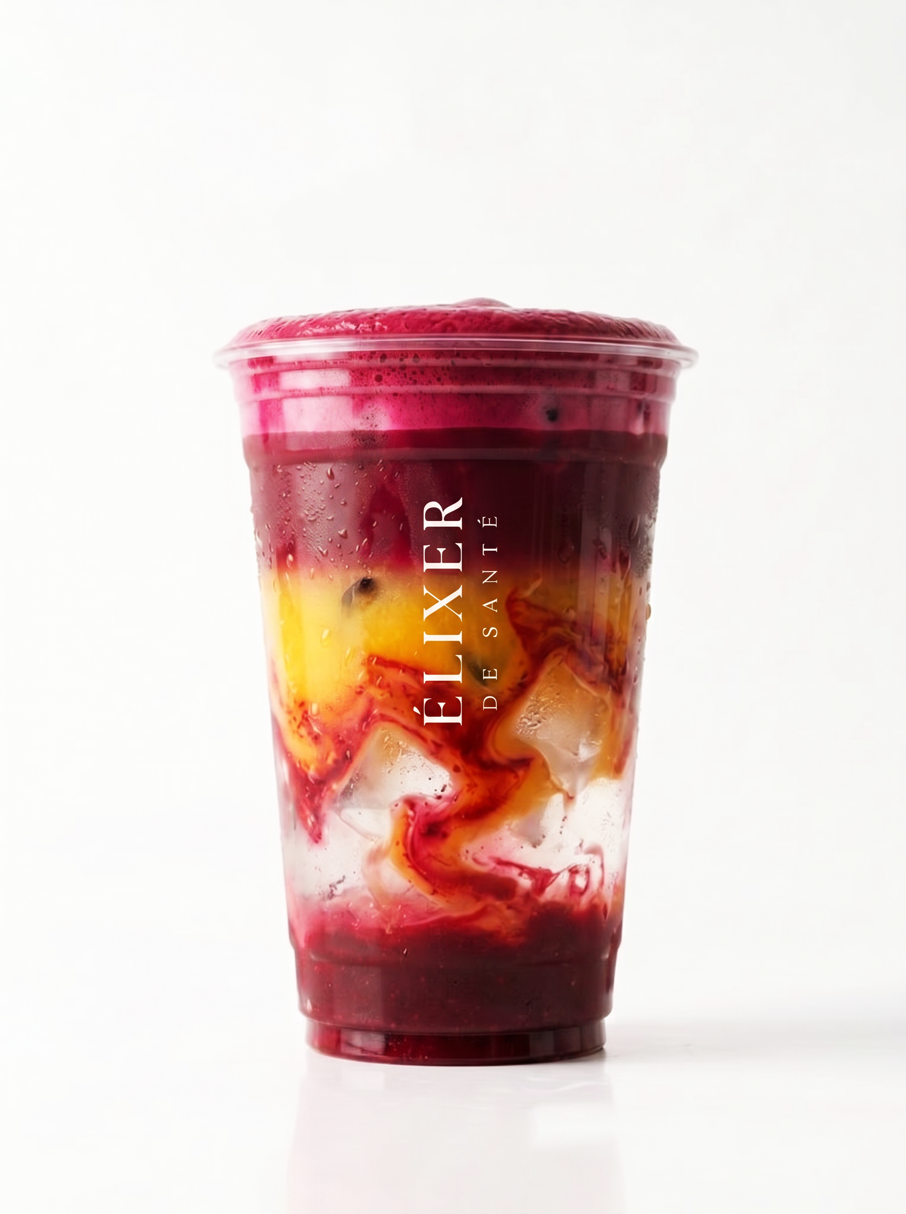 A clear plastic cup filled with a layered fruit smoothie or drink, featuring swirls of red, yellow, and dark purple or black, with condensation on the outside.