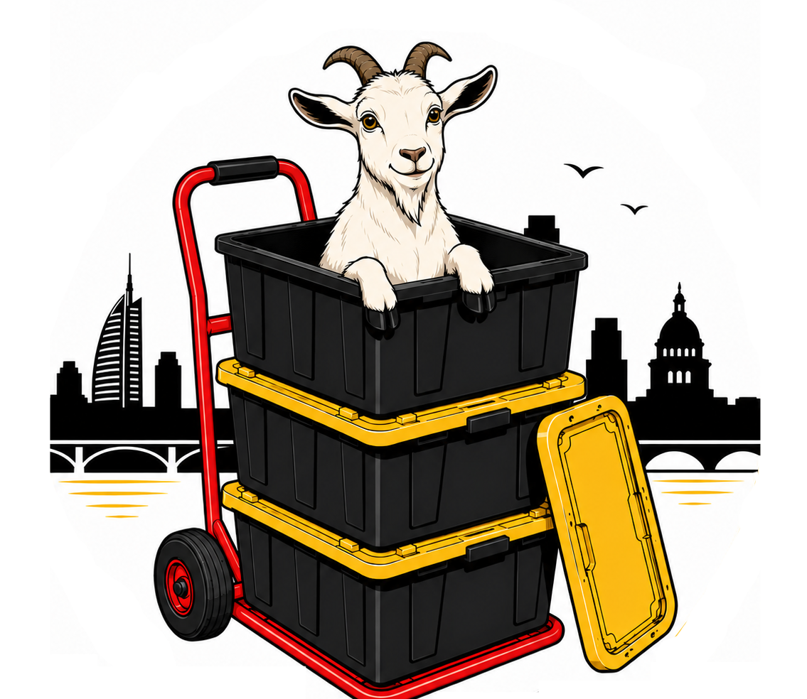 An illustration of a goat with horns sitting in a stack of three black storage bins on a red and yellow dolly. The background features a city skyline with buildings, a bridge, and birds flying.