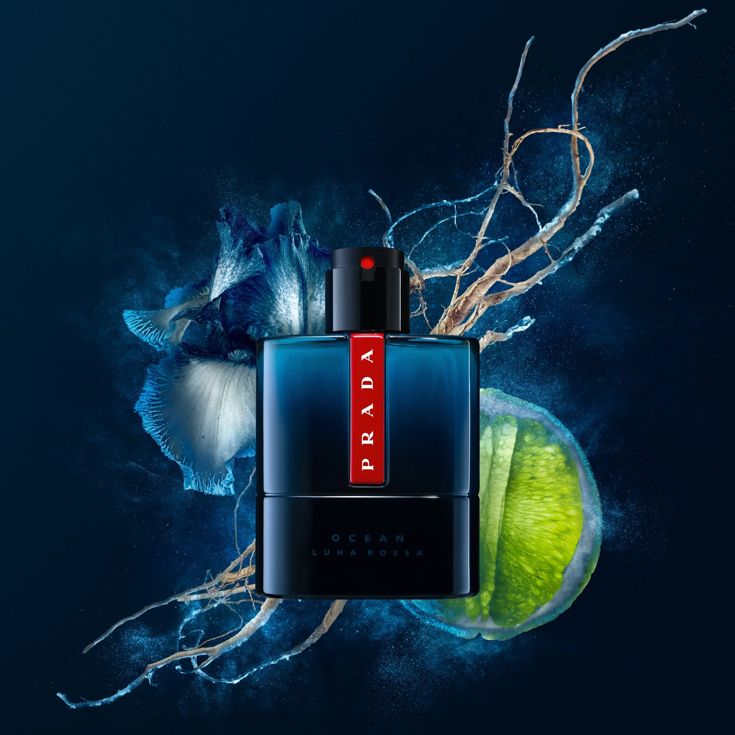 Close-up of a perfume bottle named Luna Rossa, with a dark blue background and colorful abstract art resembling ocean waves and coral.