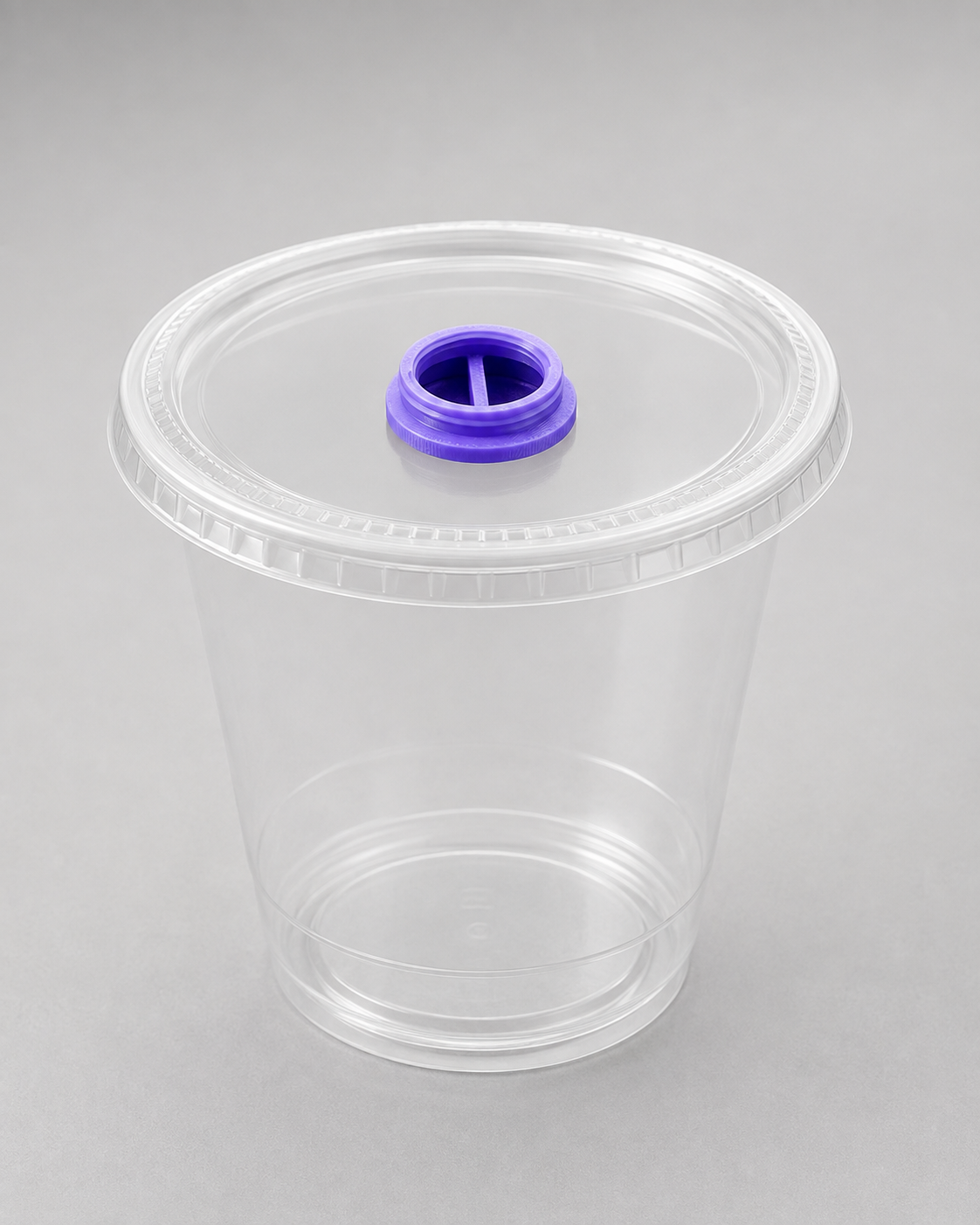 3D printed Fly Tap fruit fly culture dispensing cap installed in a clear deli cup lid for controlled feeder insect dispensing.