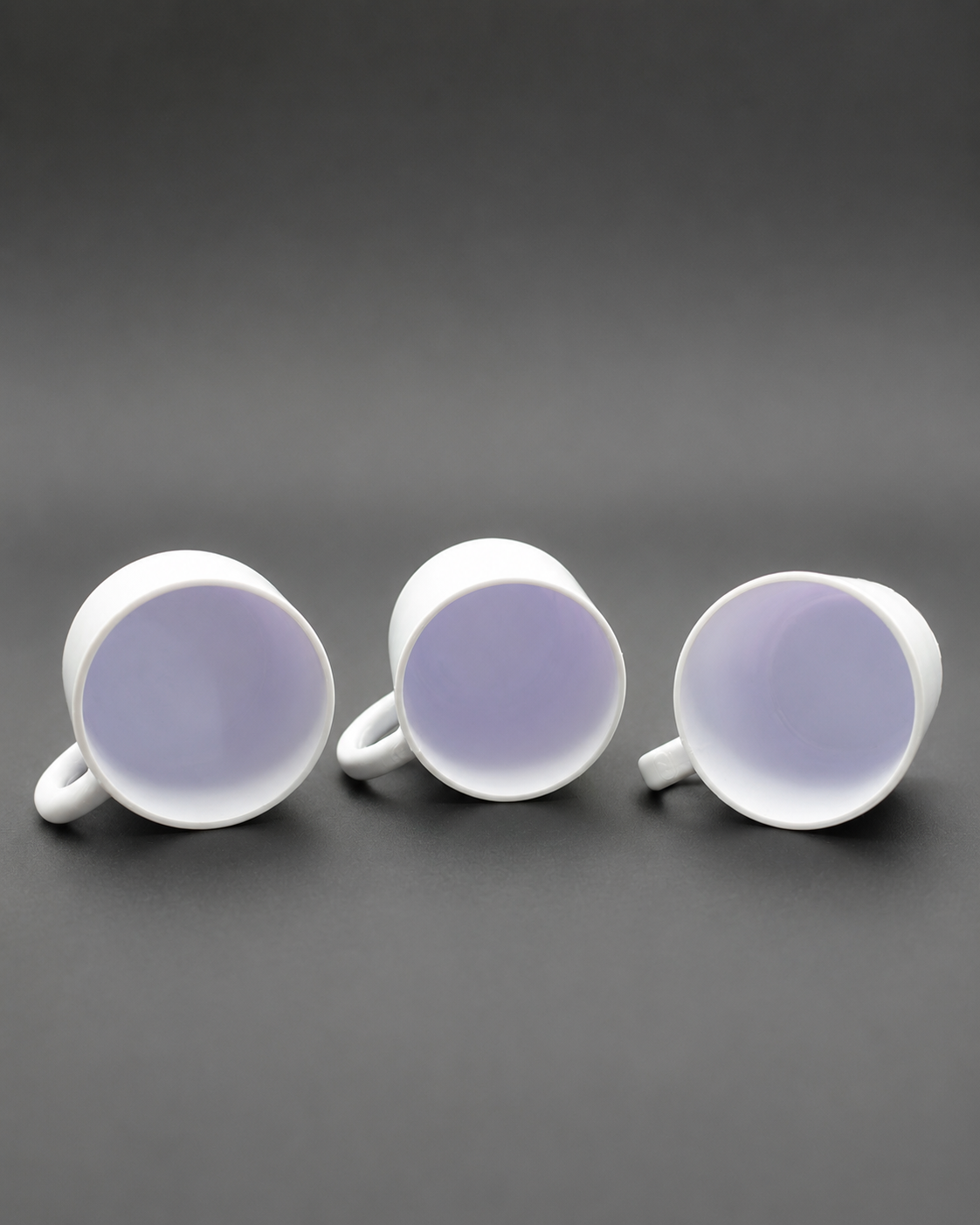Interior view of three miniature 3D printed Cozy Cup Hides designed as small retreats for jumping spiders.
