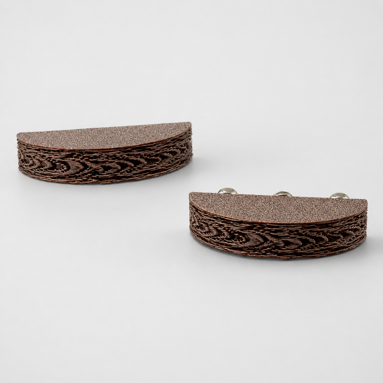 Angled view of two brown Woodland Ledges showing the textured tops and decorative bark-style curved edges.