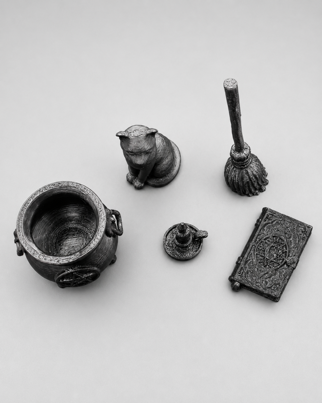 Five-piece miniature witch decor set with 3D printed cauldron, black cat familiar, broom, candle and spellbook for jumping spider enclosures.