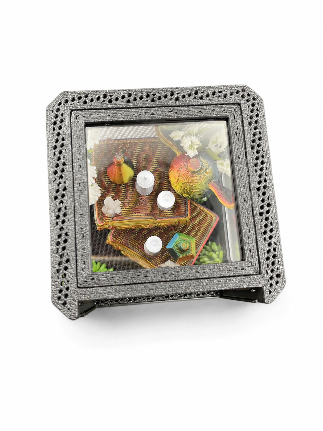 Top view of a wizard-inspired jumping spider enclosure featuring stacked miniature books, magical decor and a tiny golden winged ball.