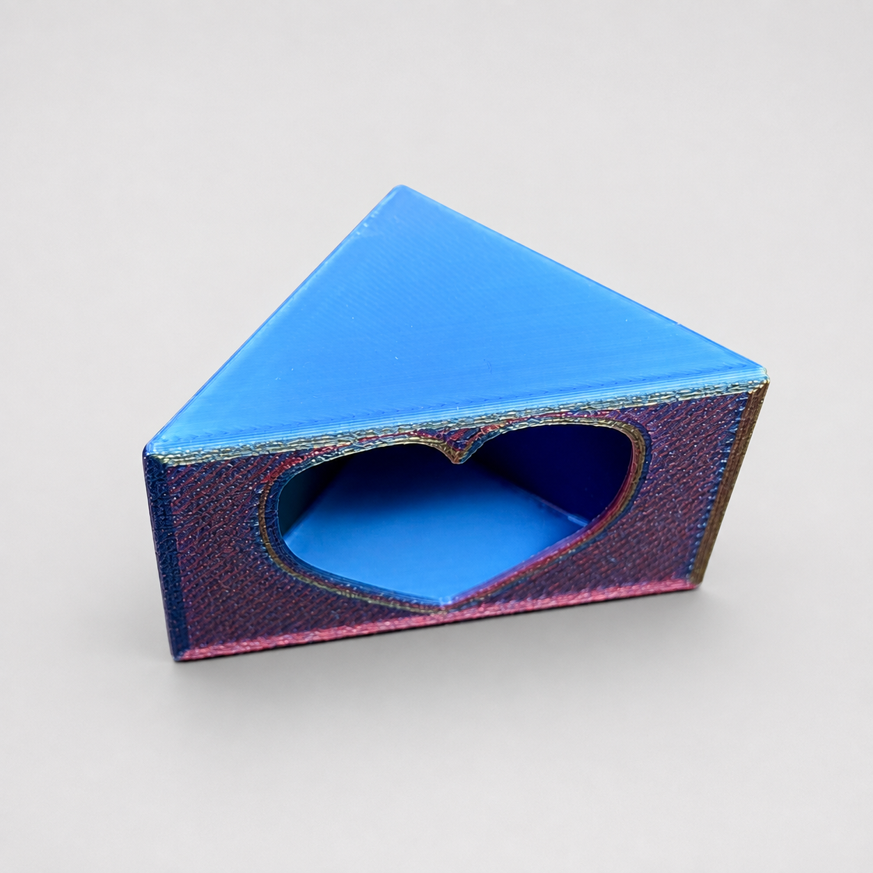 Angled view of The Love Nest showing the heart-shaped opening and sheltered interior of the 3D printed jumping spider hide.