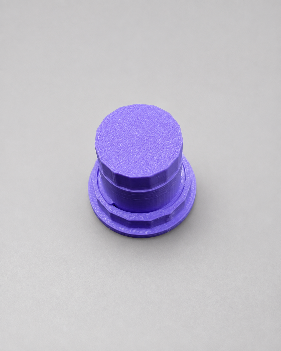 Top view of an assembled purple 3D printed Fly Tap fruit fly culture dispensing cap for spider and invertebrate feeding.