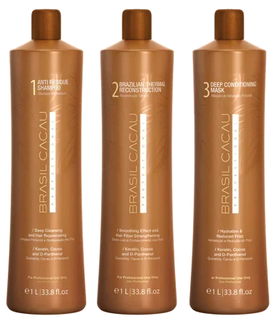 Three brown bottles of Brasil Cacau hair care products with gold caps, labeled as anti residue shampoo, Brazilian thermal reconstruction, and deep conditioning mask.