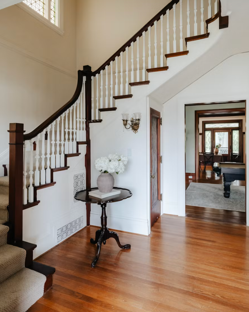 staircase in house with wood floors