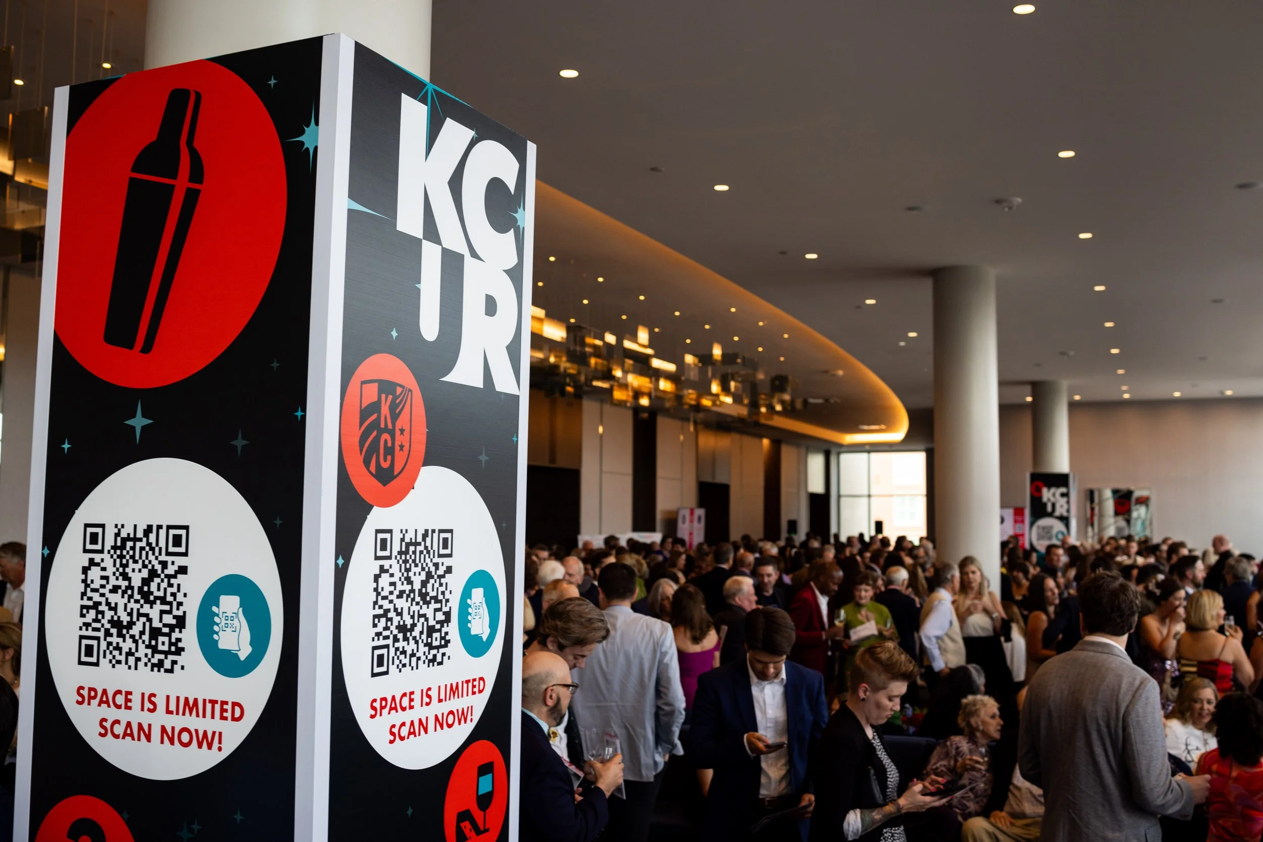 These large columns featured QR codes and icons at random heights to allow everyone access to the auction.  