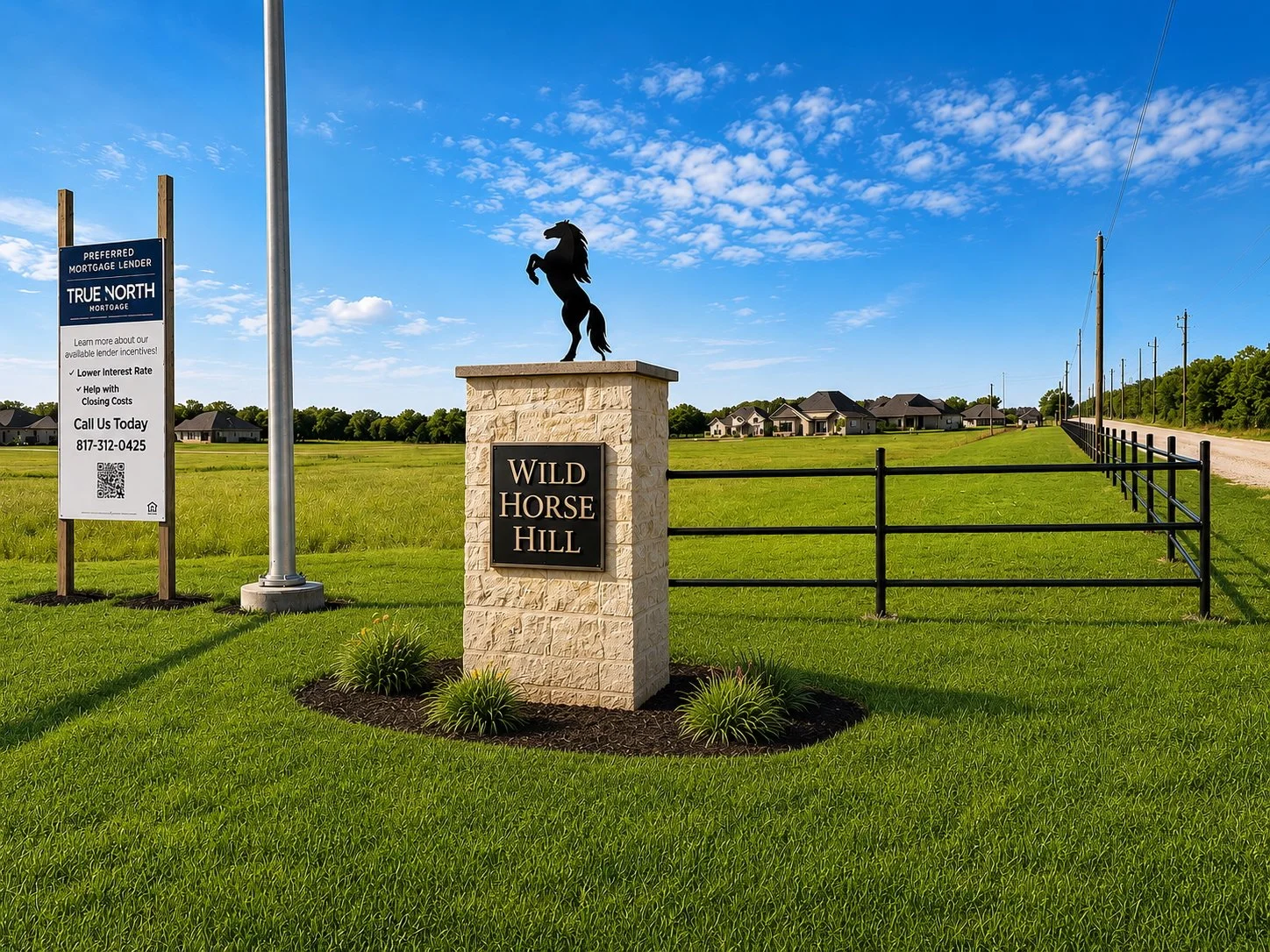 Entrance sign for Wild Horse Hill subdivision with a black horse statue on a beige stone pillar, green grass, a black fence, and houses in the background under a blue sky with clouds.