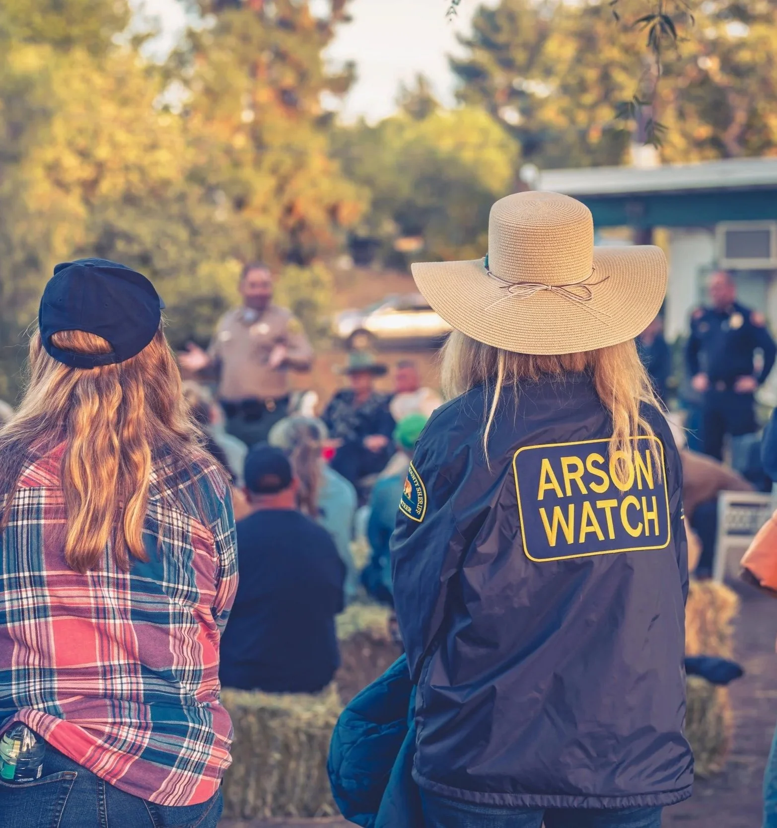 Photo of Arson Watch board members listening to LASD Captain Carr and LAFD Assistant Fire Chief Drew Smith speak at a Large Animal Preparedness event. Photo by organizater AW member Roisin O’brien,