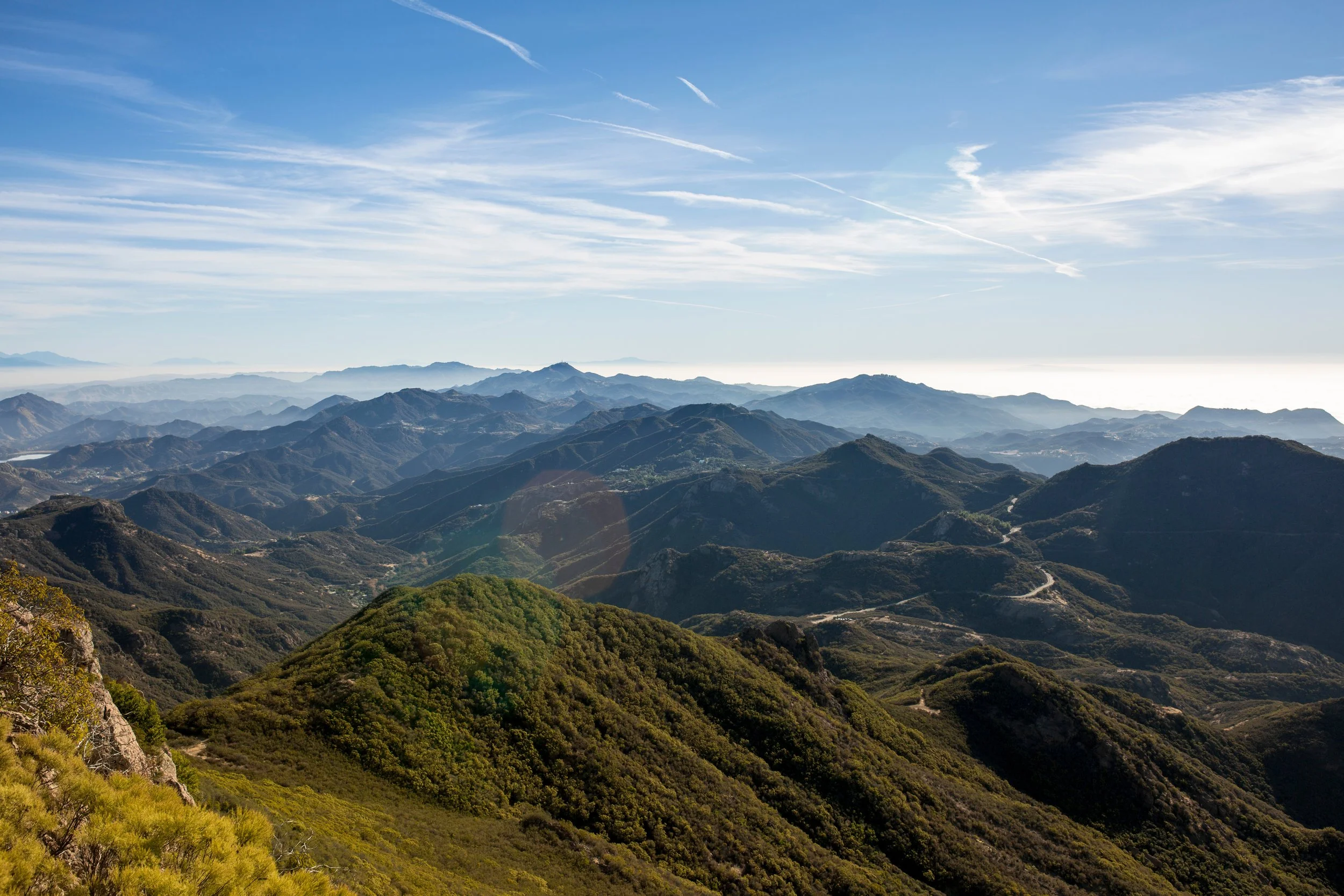 A photo of the Santa Monica Mountains with a road weaving through a canyon