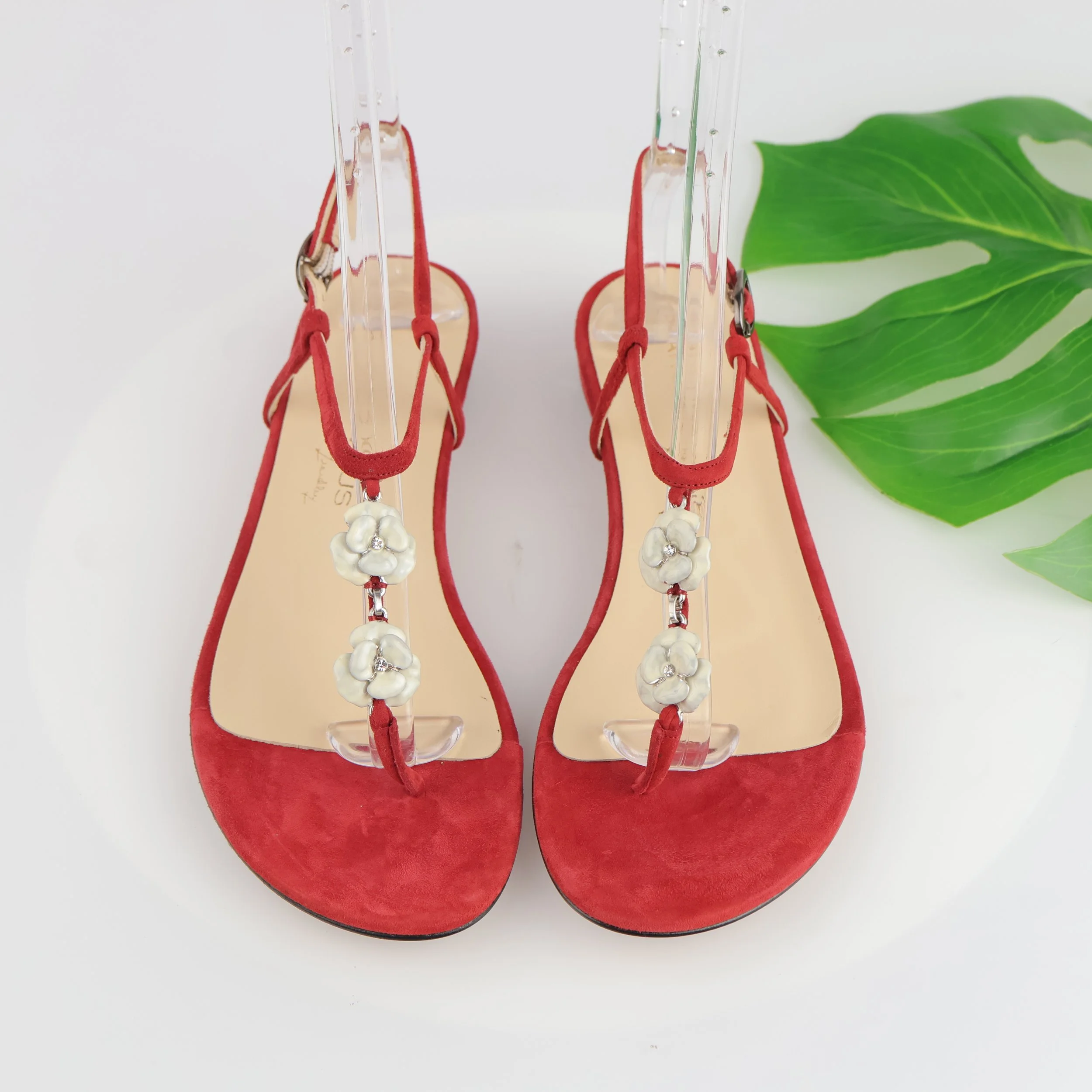 Red strappy sandals. 