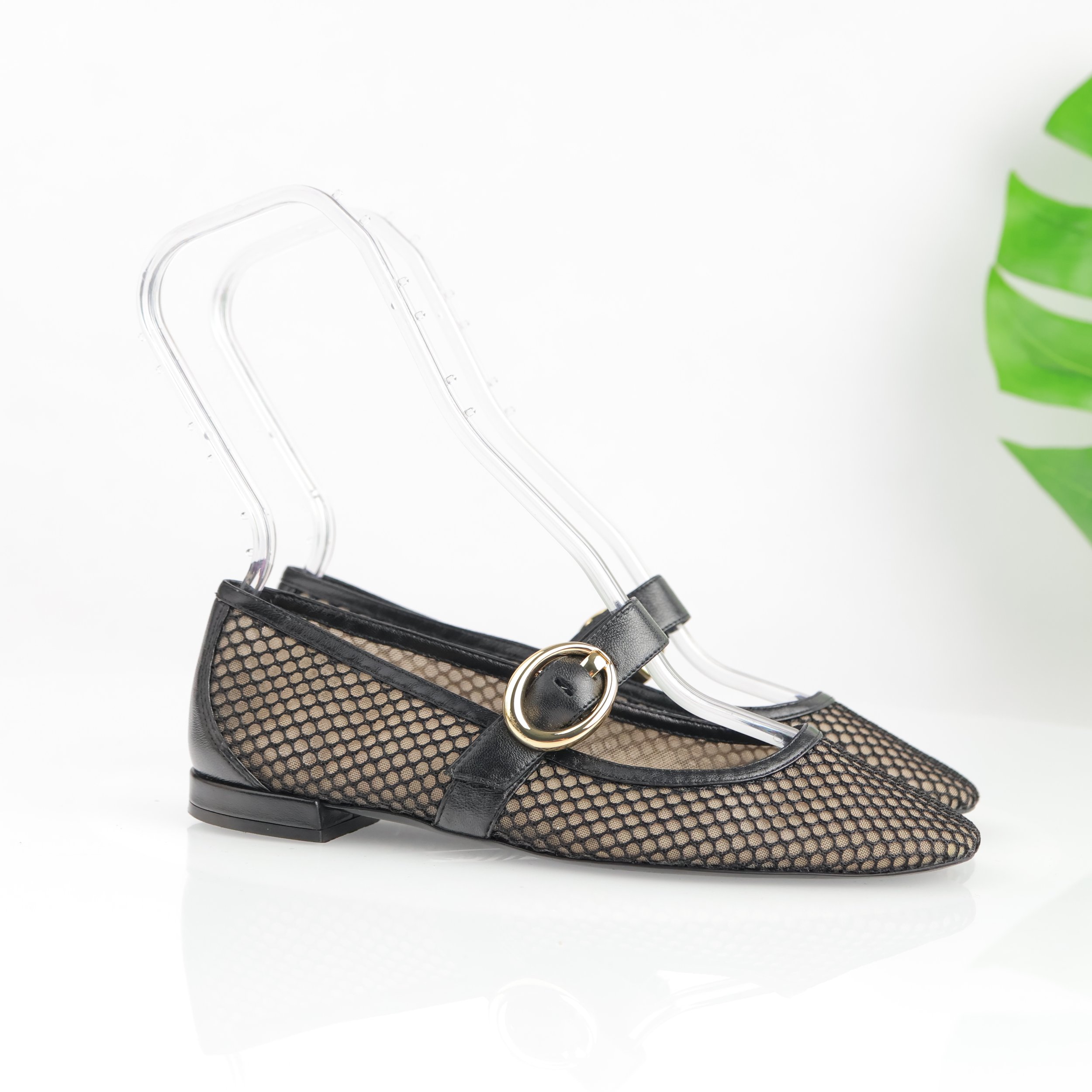 Black Mary Jane mesh flats.