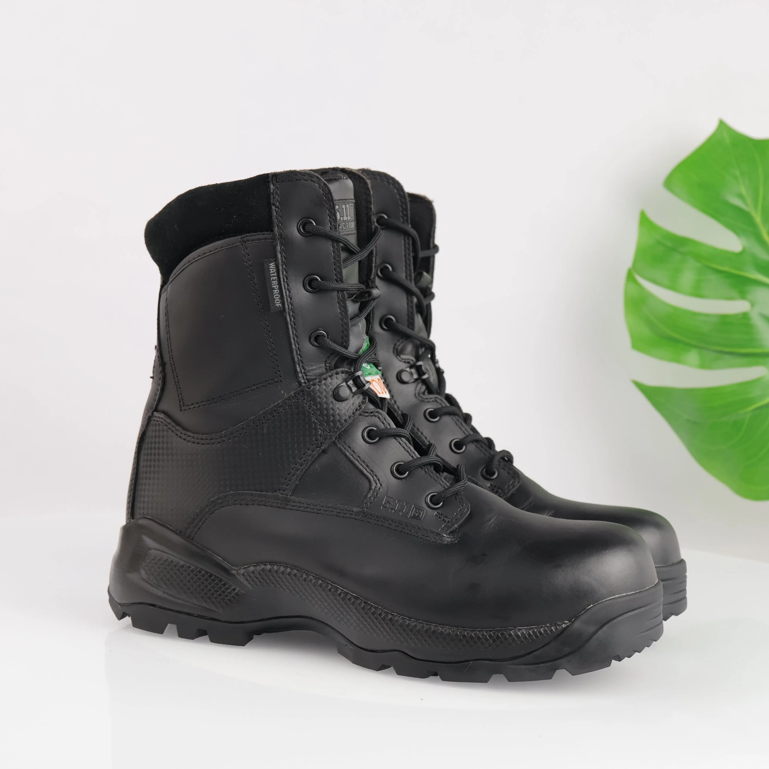Black lace-up combat boots. 