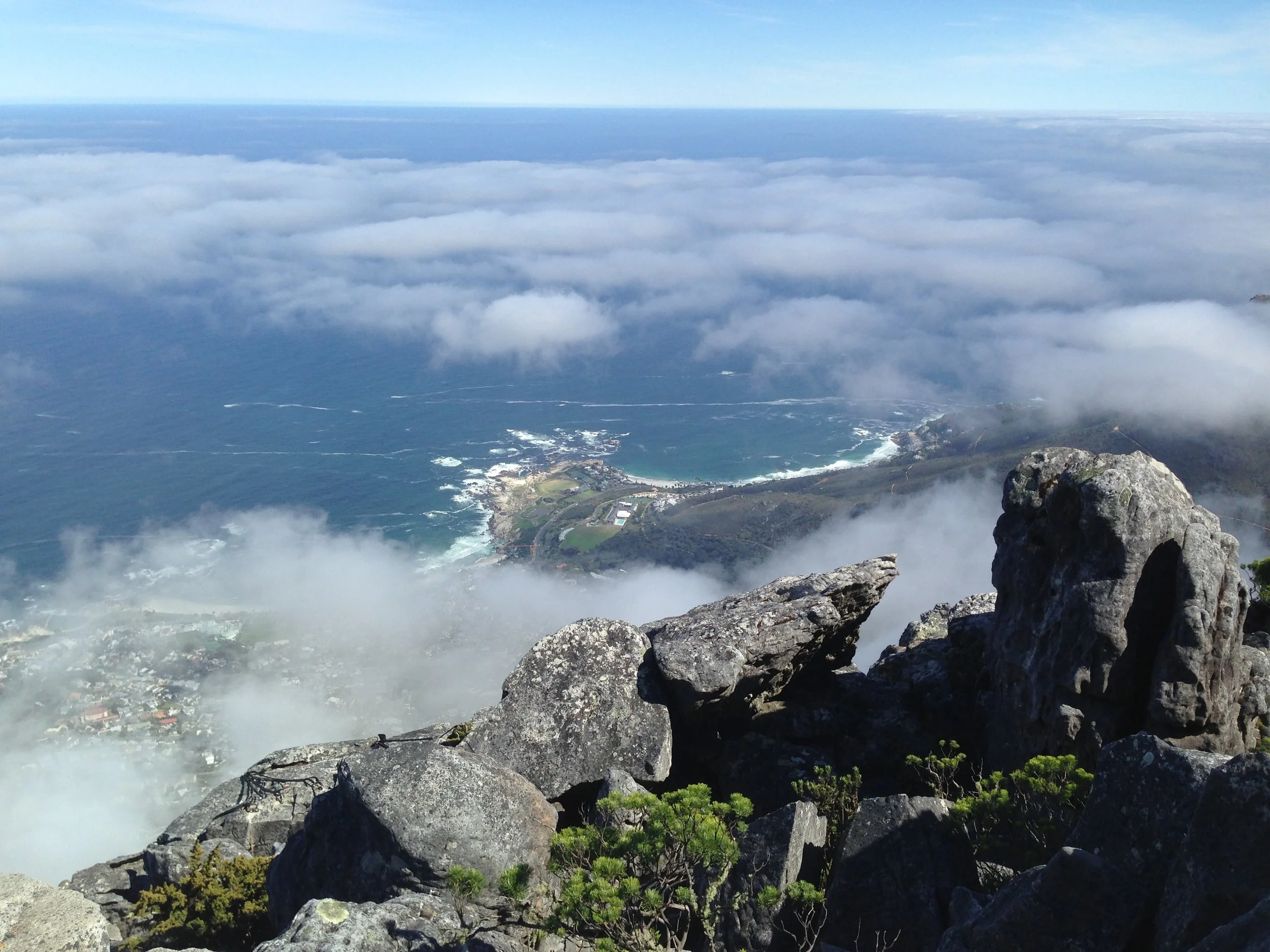 Clouds drifting over Cape Town and the coast, viewed from Table Mountain.
