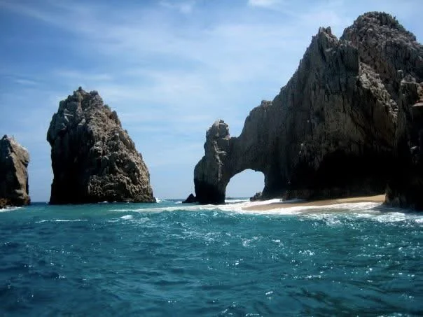 The natural arch at Cabo San Lucas rising above the ocean.