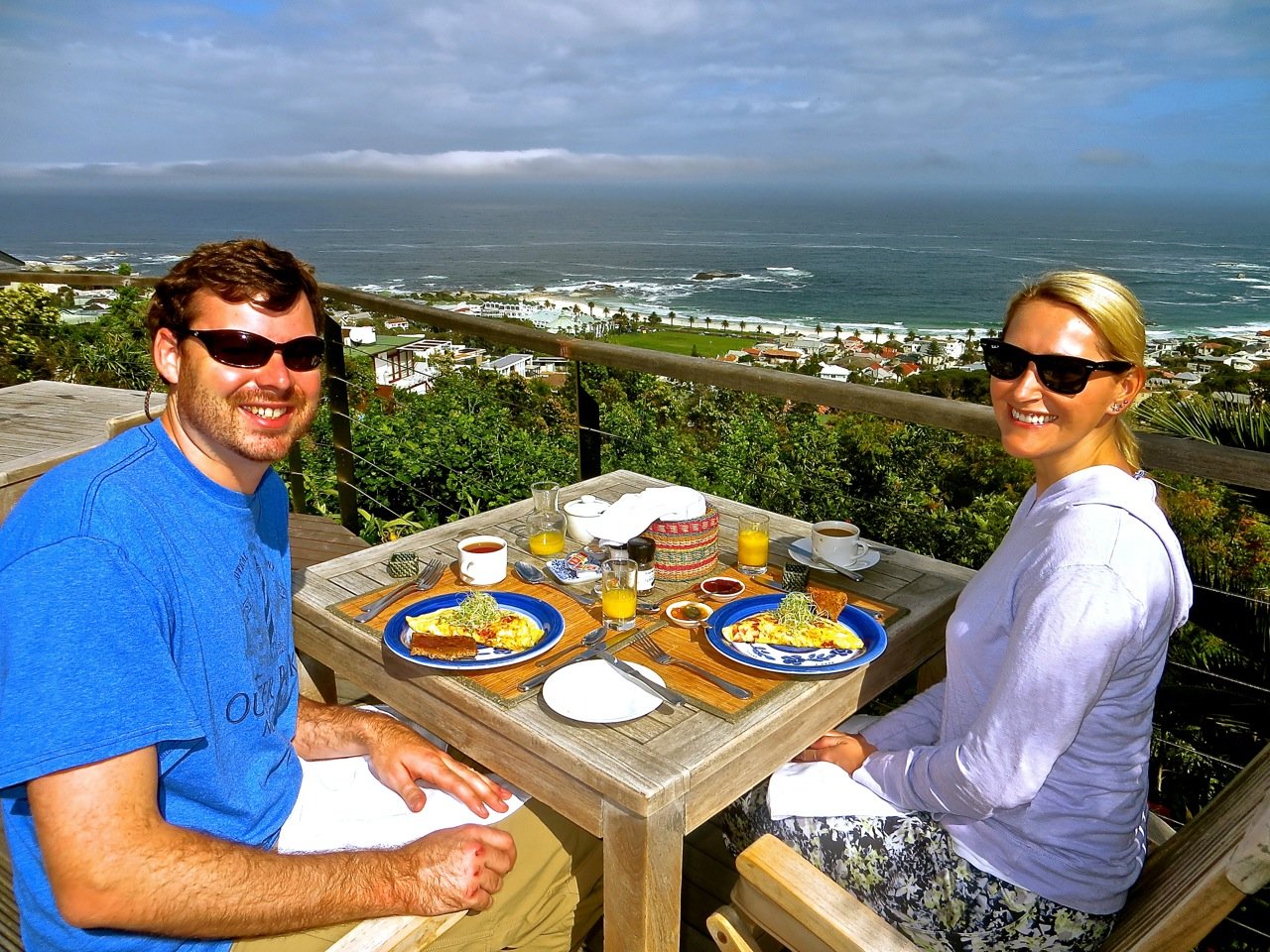 A couple having breakfast with a view of Camps Bay from Boutique @10.