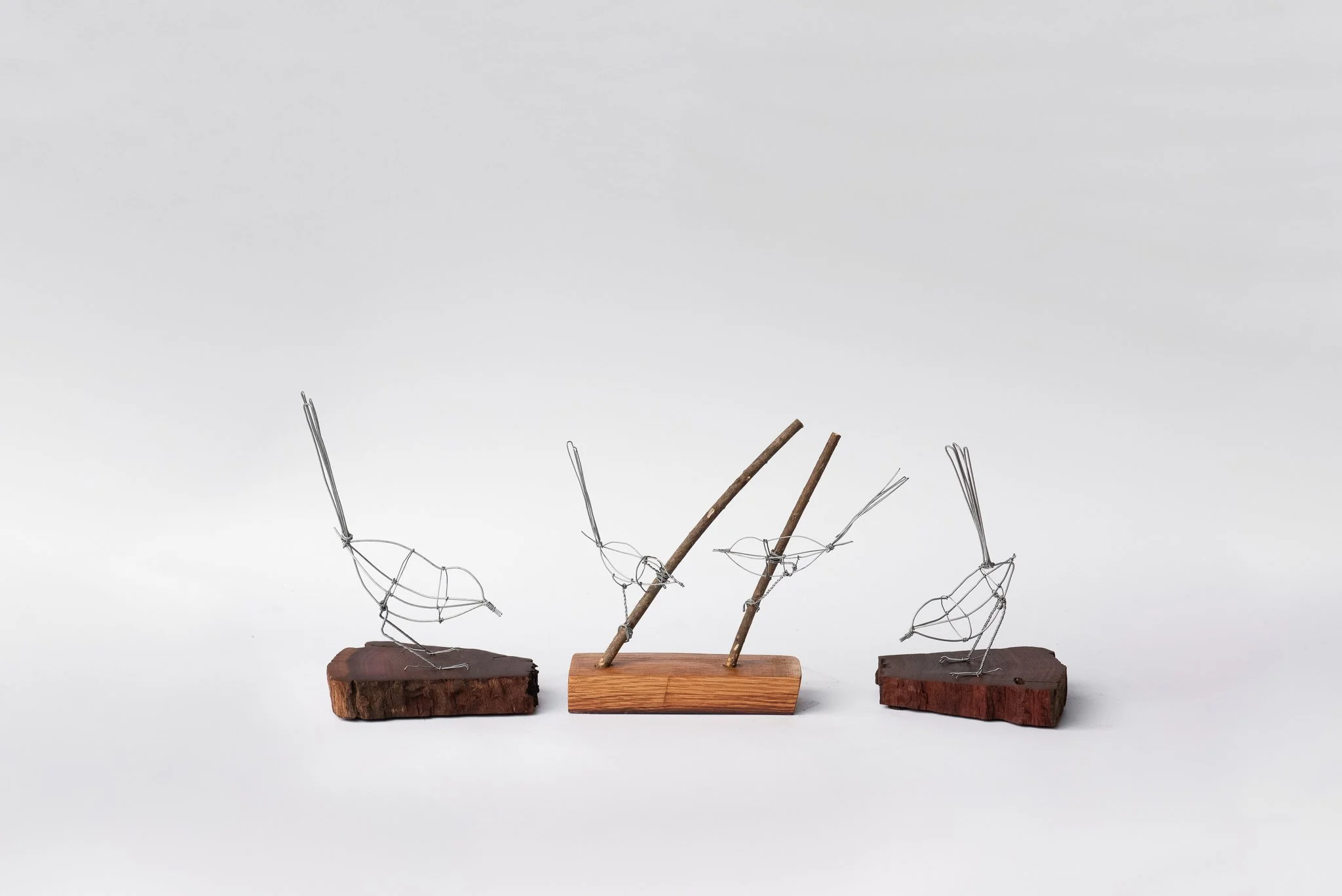 Three wire and wood art sculptures of birds by The Wire Studio on Melbourne's Mornington Peninsula