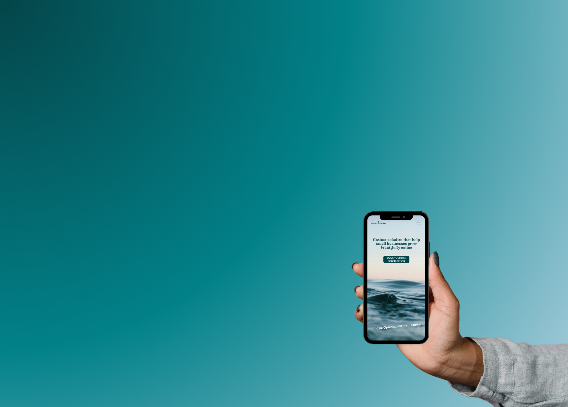 Innerbloom Studio website showcased on an iphone in a woman's hand in front of a turquoise-blue ombre backround