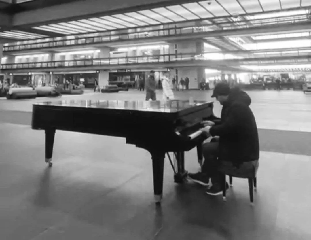 Chris playing a grand piano at Bell Labs in New Jersey