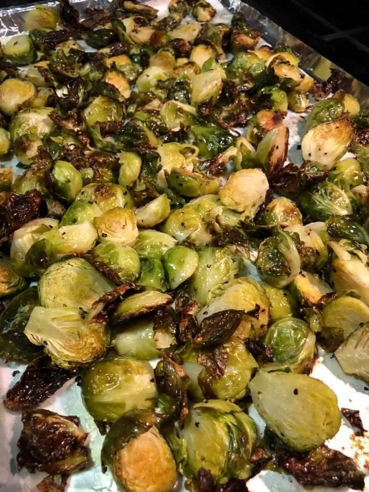 Roasted Brussels sprouts on a baking sheet.