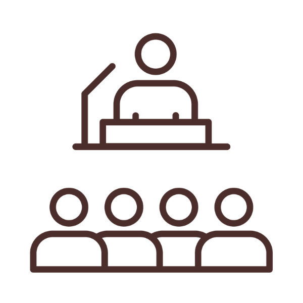 Line drawing of a person speaking at a podium in front of an audience.