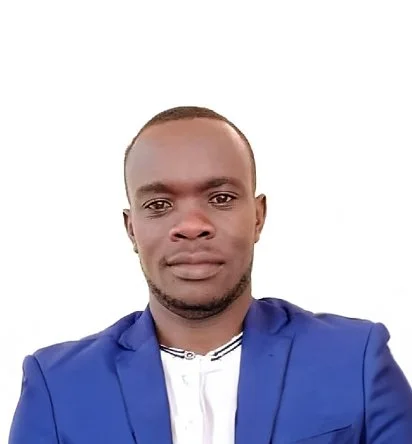 Portrait of a man wearing a blue suit and white shirt against a plain white background.