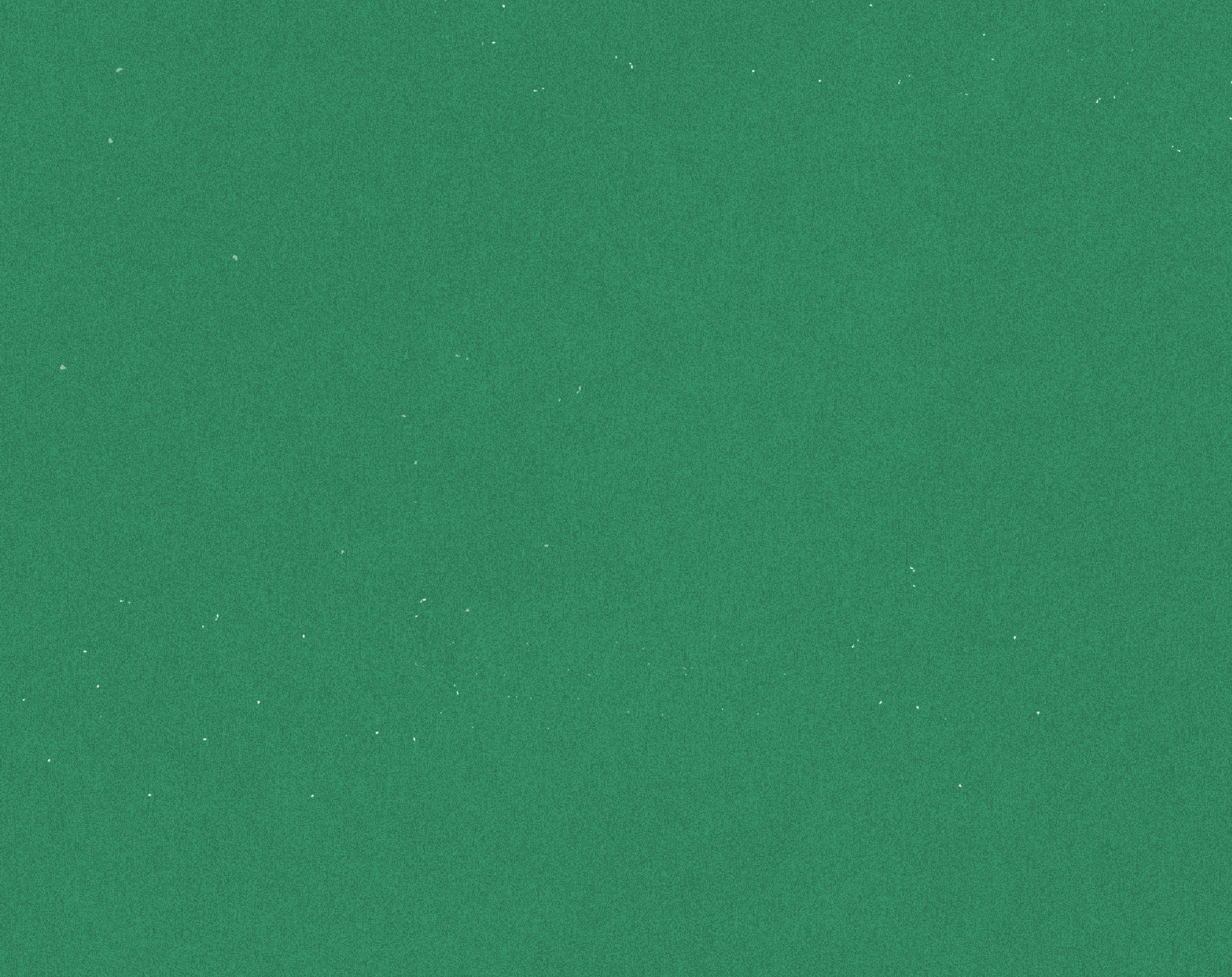 Green speckled background with small white spots scattered throughout.