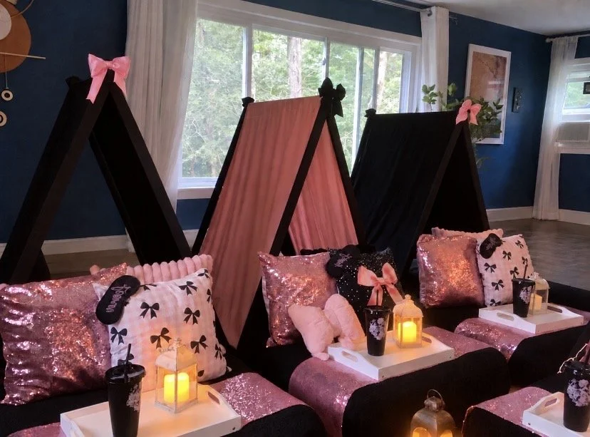 Pink and black luxury teepee sleepover and slumber party setup with coquette bows, sequin pillows and personalized décor in Connecticut