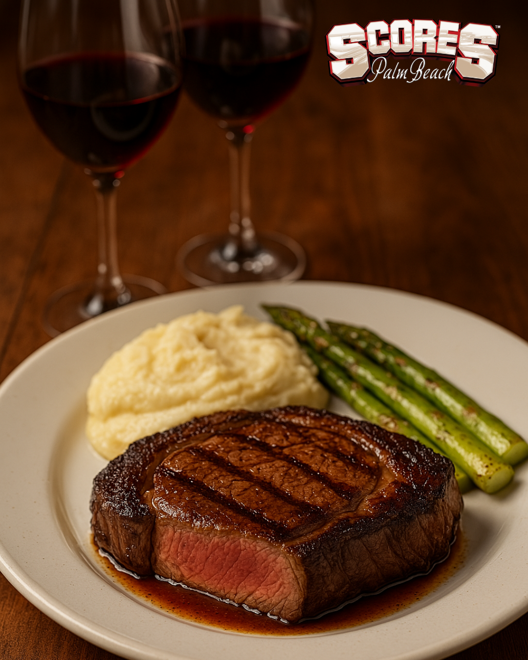 Ribeye steak with sides at Scores Palm Beach steakhouse