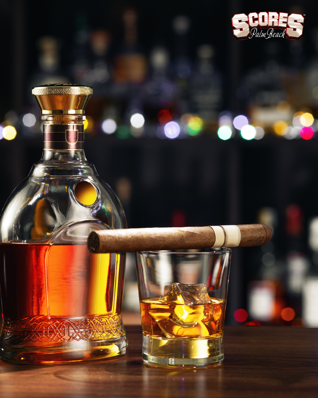 VIP experience at Scores Palm Beach with exclusive bottle service, private seating, sparklers, and glamorous nightlife ambiance.