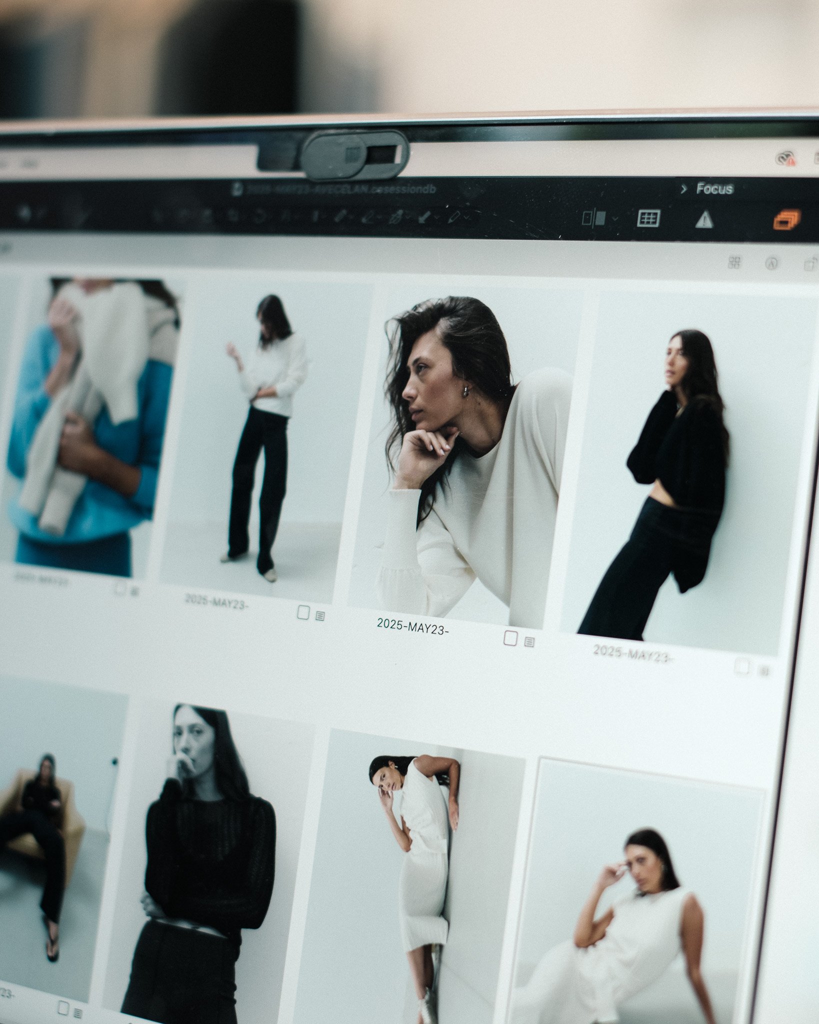 Computer screen displaying a photo gallery with images of women posing, various outfits, and settings.