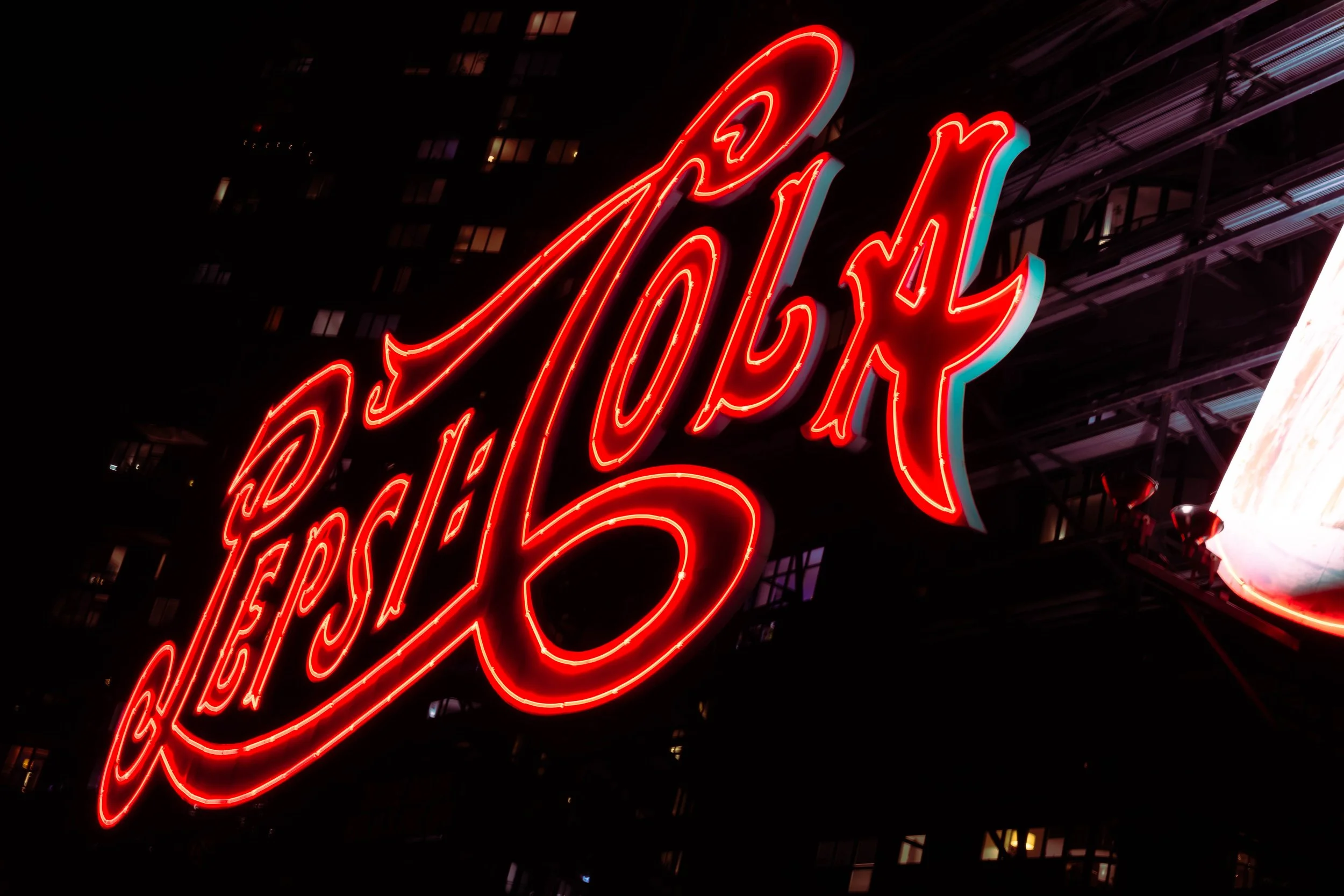 A night shot of the Pepsi sign in Queens NYC.