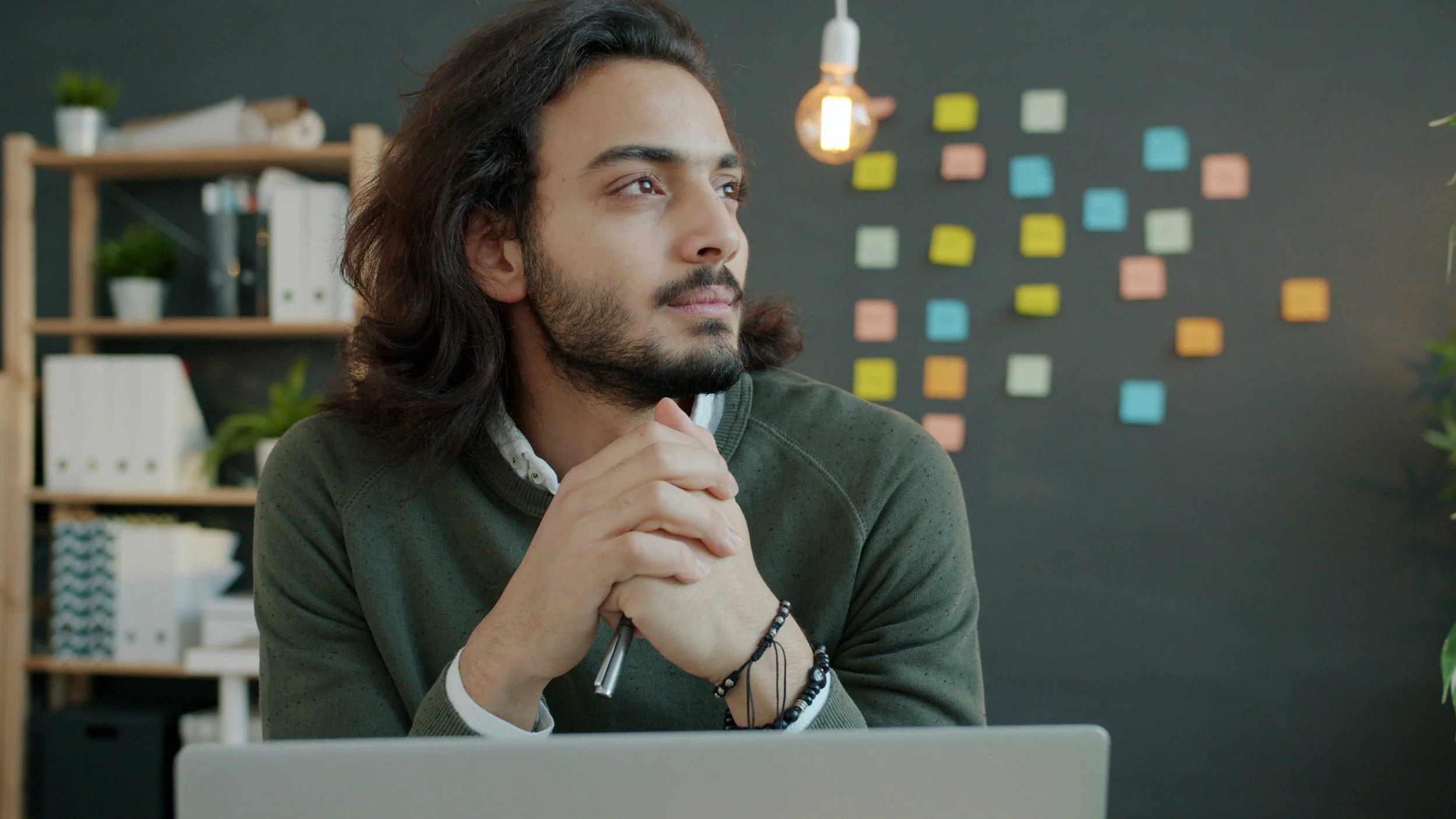 A man in an office takes a moment of mindfulness