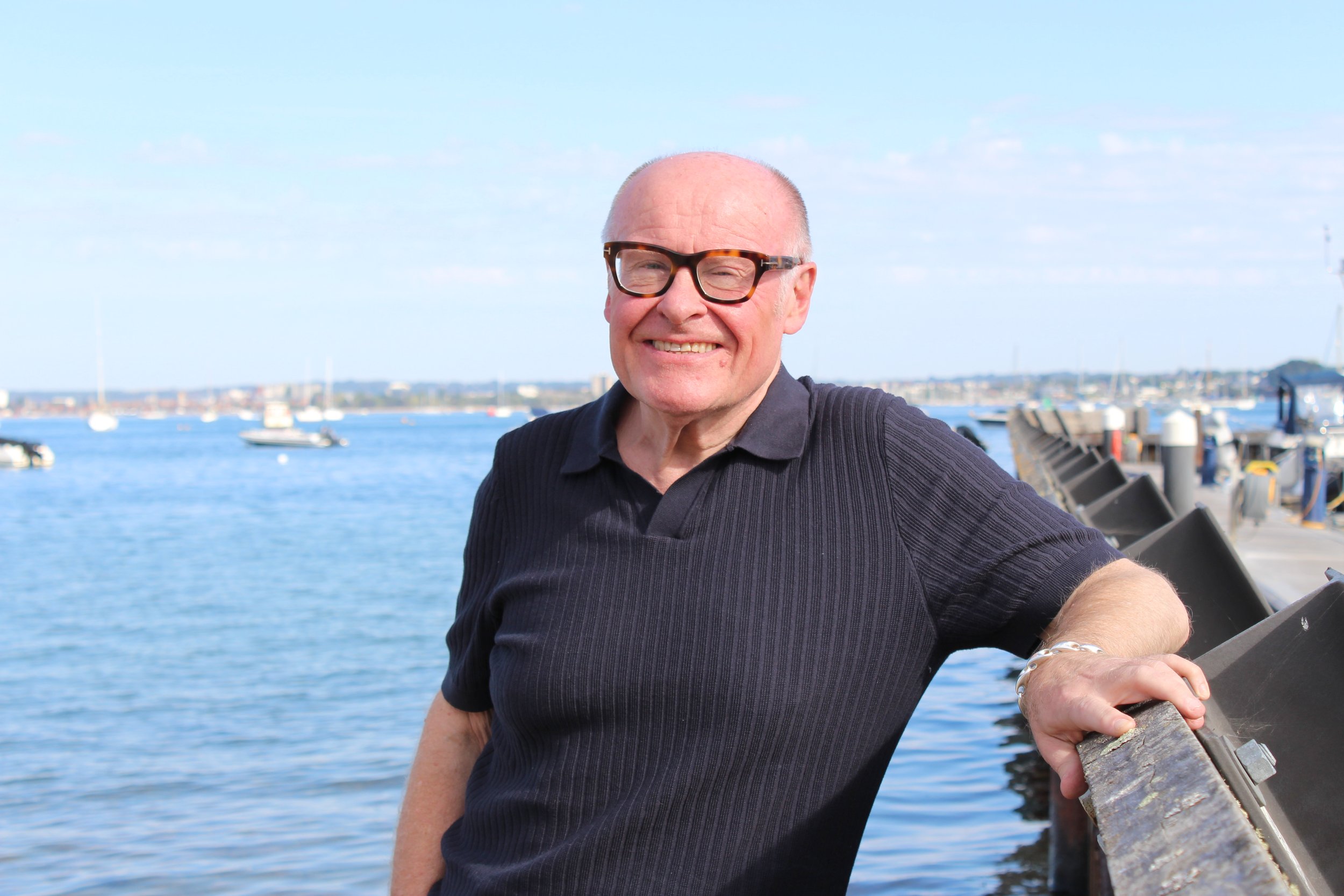 Simon Scarborough smiles at Poole Quay. A friendly face, a helping hand. A range of services available. Premium lifestyle management for busy families and professionals in Bournemouth, Poole and Dorset.