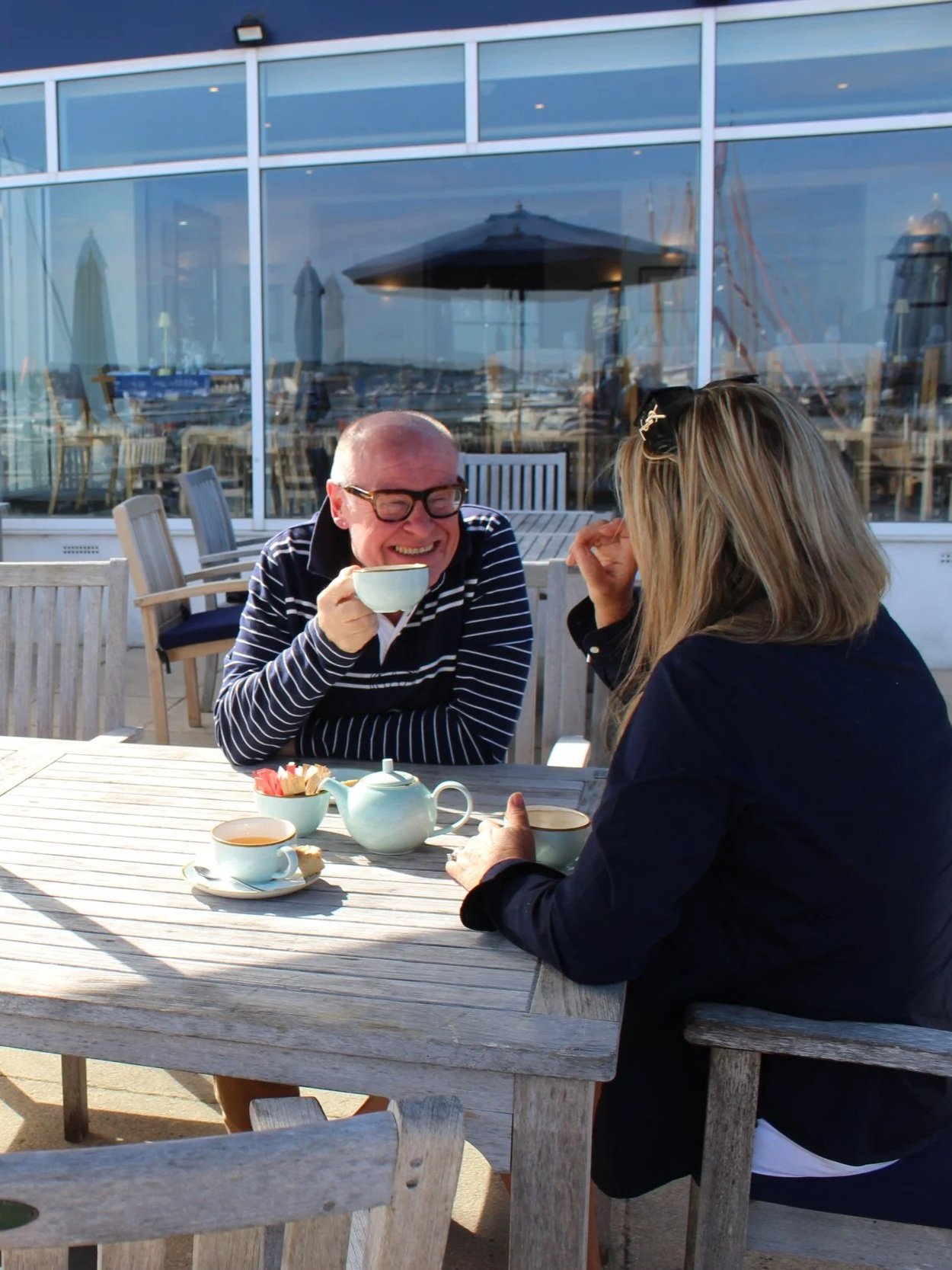 Simon Scarborough smiles at Poole Quay. A friendly face, a helping hand. A range of services available. Premium lifestyle management for busy families and professionals in Bournemouth, Poole and Dorset.