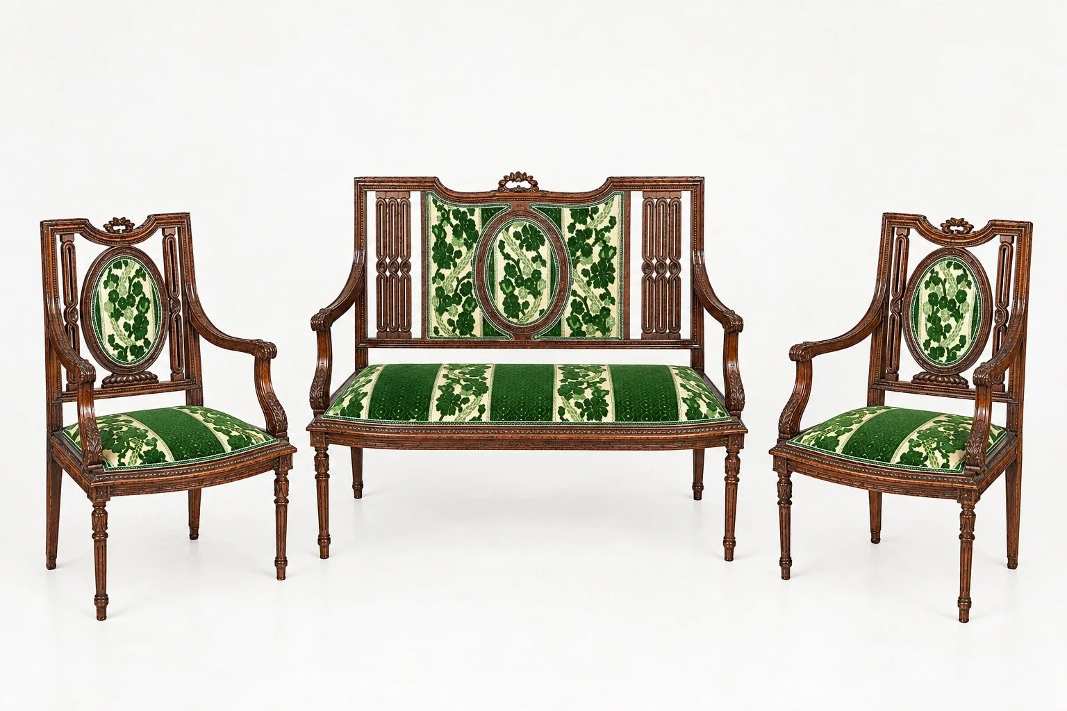 Sophisticated three-piece seating ensemble comprising an elegant settee and two matching armchairs, distinguished by richly carved wooden frames and refined green-and-ivory upholstery.
The backrests combine architectural openwork panels with decorati