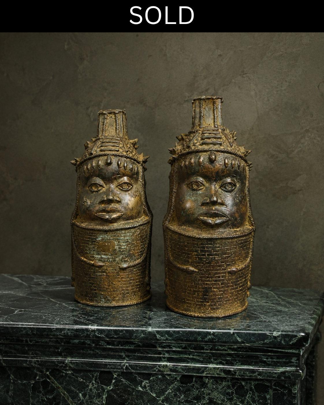 Pair of sculptural patinated brass figures.
African, possibly Edo-inspired.
The figures are distinguished by their rich patinated finish, highly worked surfaces and expressive stylised faces. They combine geometric patterning with intricate botanical