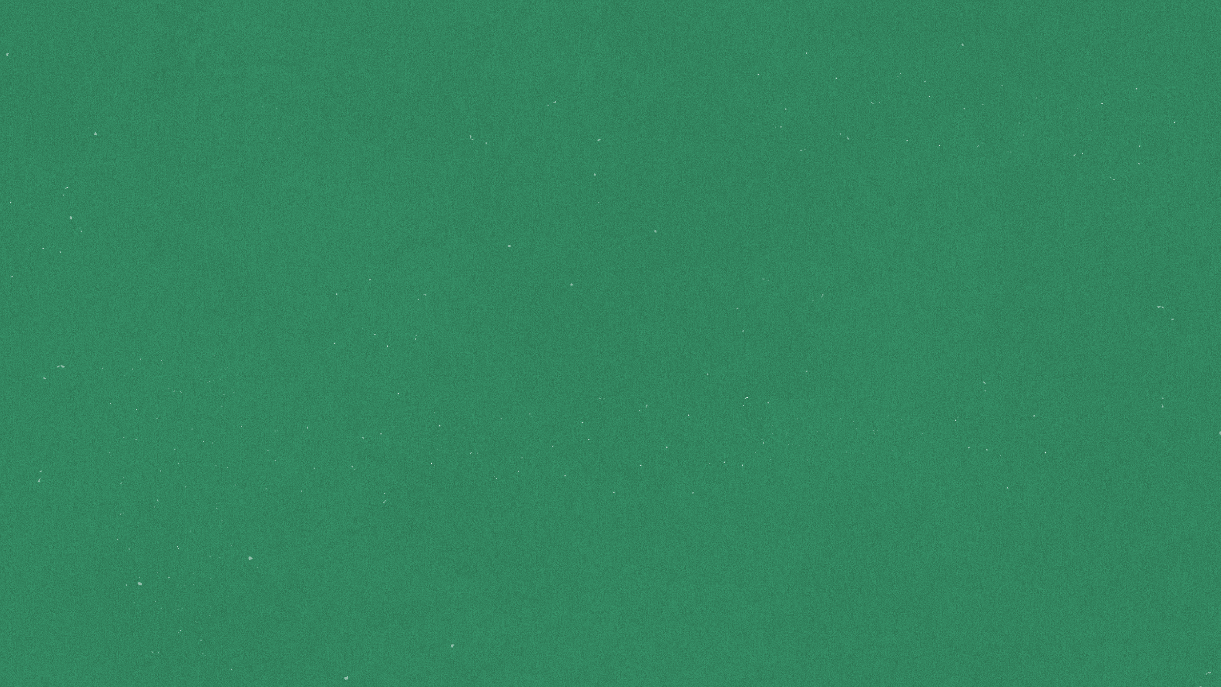 A plain green textured background with small white specks scattered throughout.