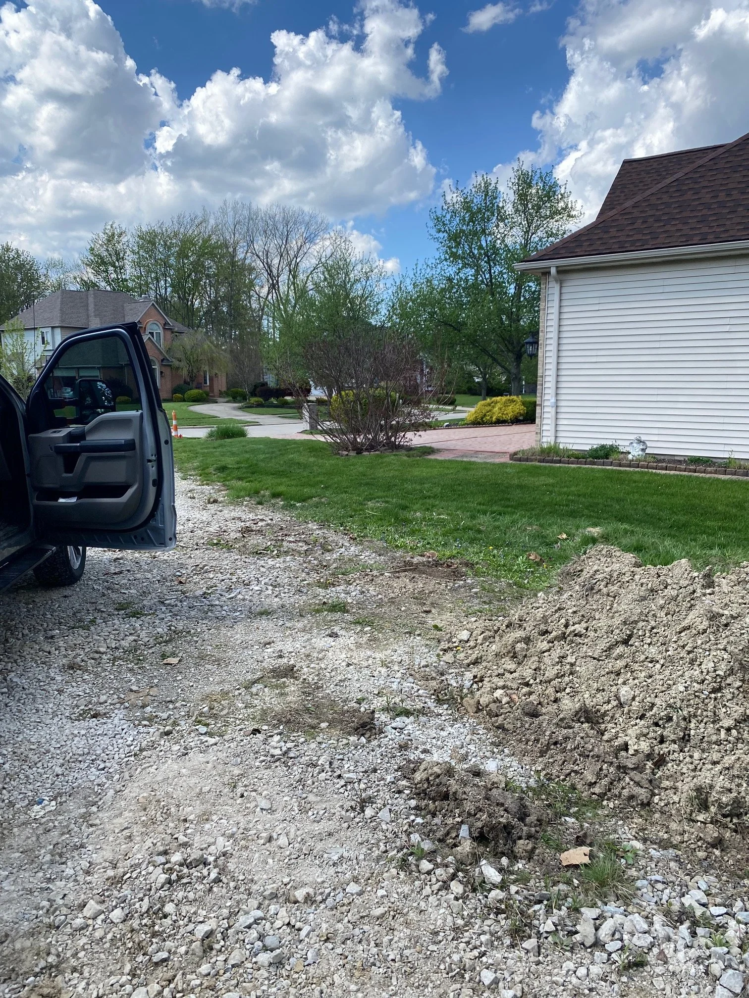 A gravel driveway with after being cleaned up by h&h property services in Strongsville Ohio