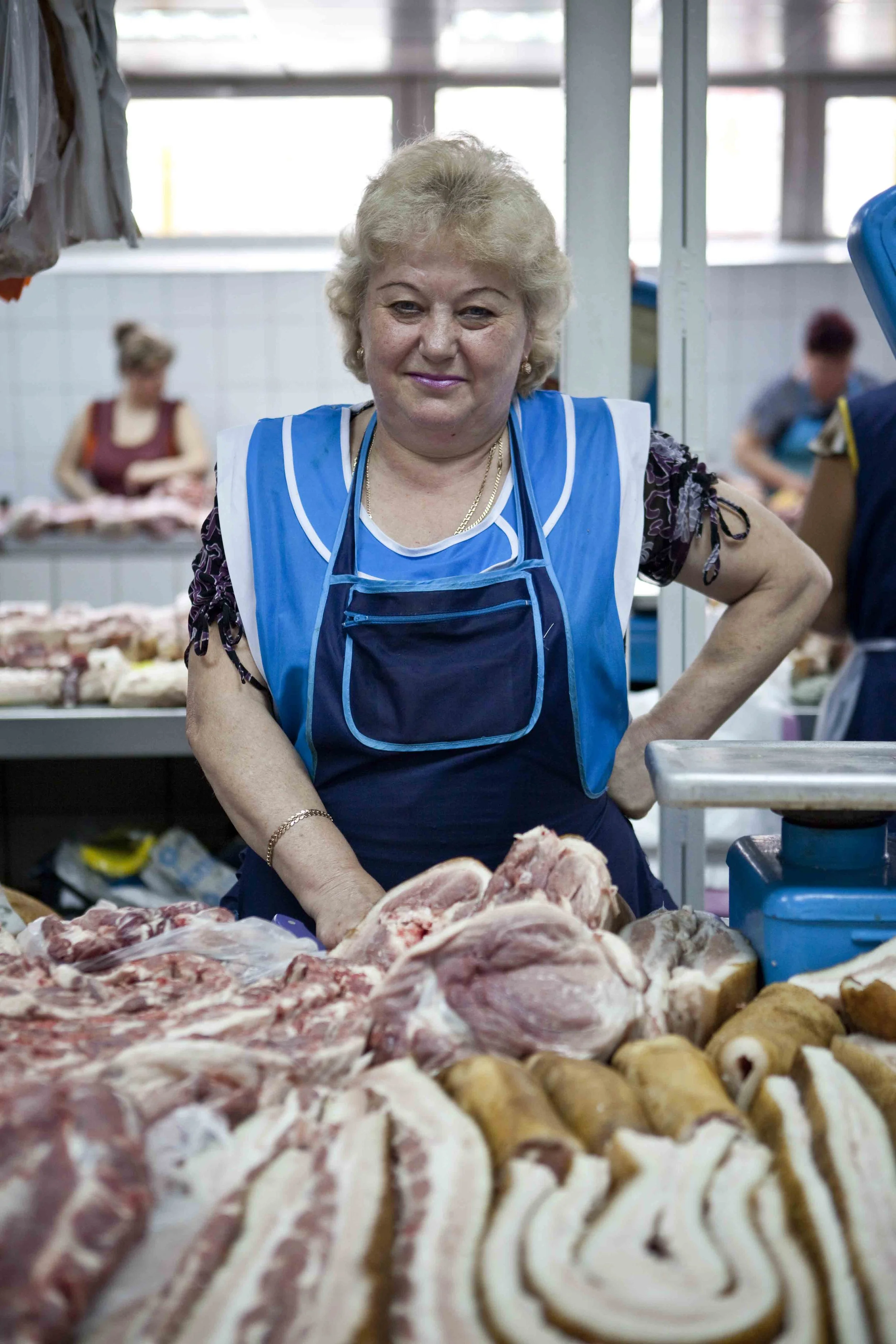 Produce seller at a central market in Kyiv, Ukraine. 