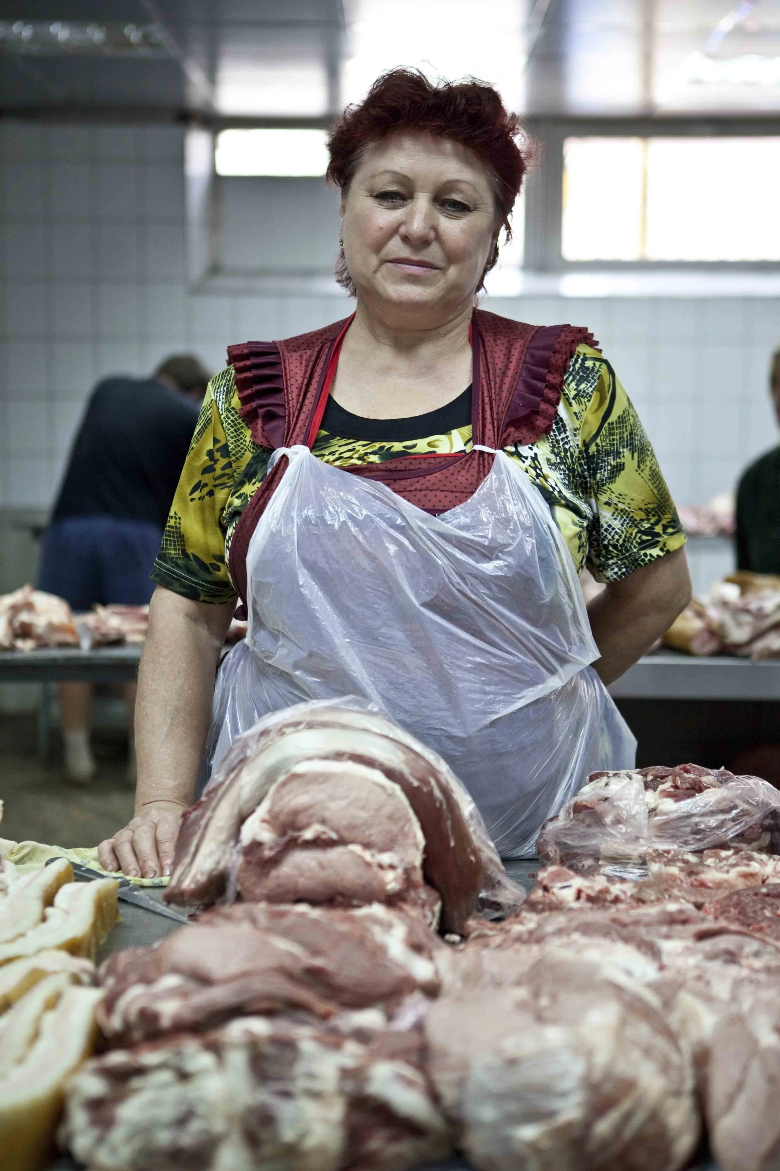 Produce seller at a central market in Kyiv, Ukraine. 